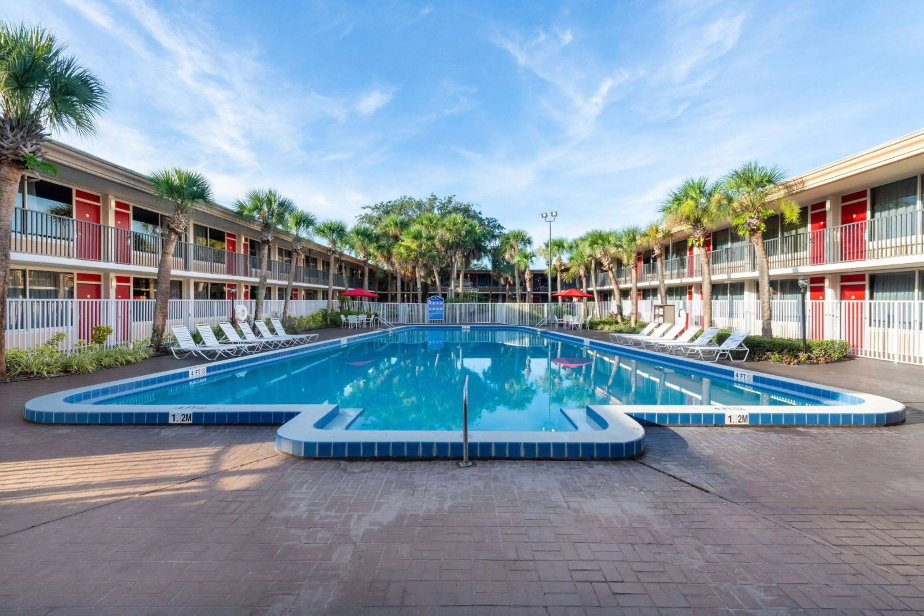 Pool view in Ramada by Wyndham Kissimmee Gateway - Free Theme Park Shuttle