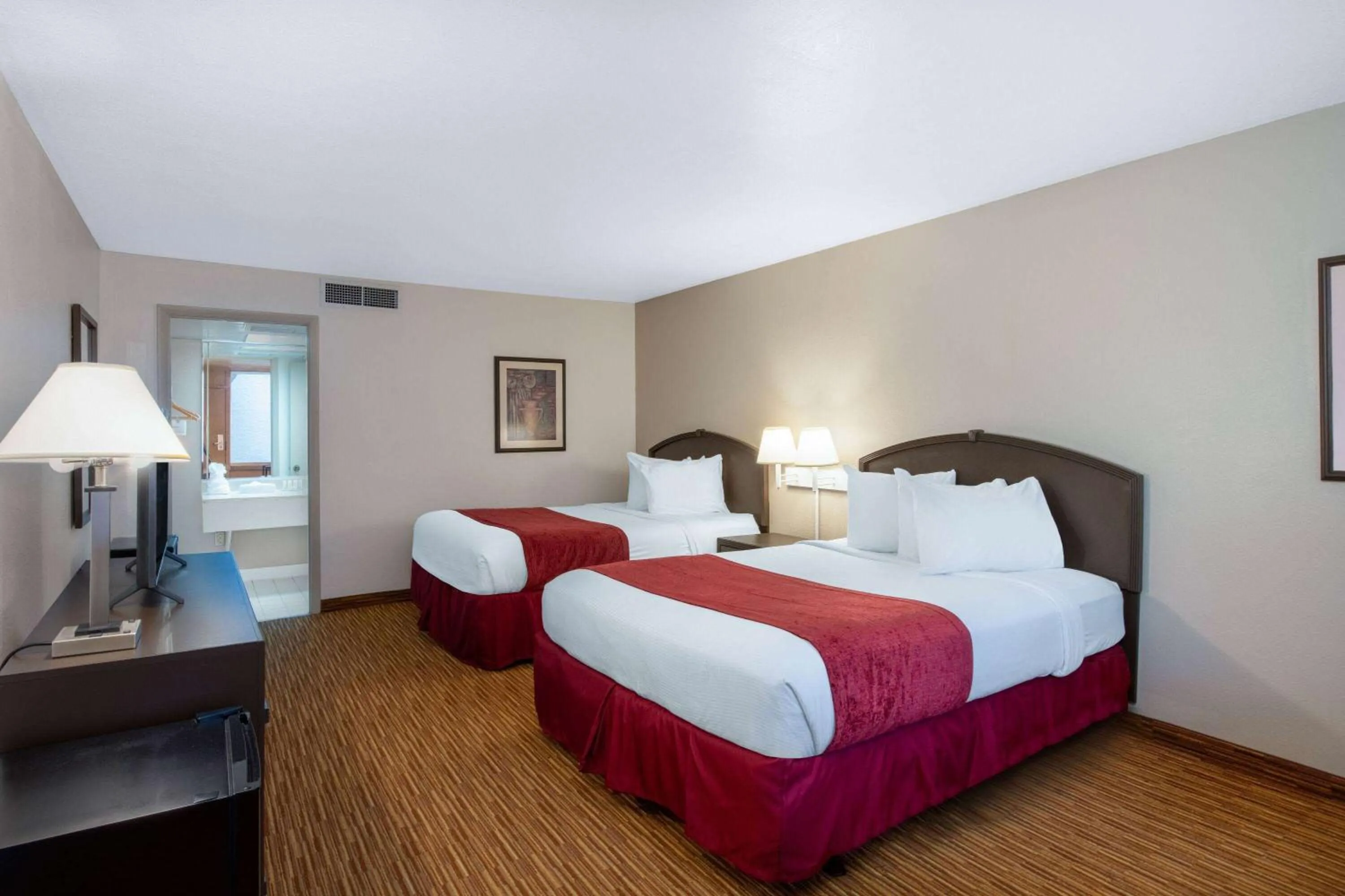 Photo of the whole room, Bed in Ramada by Wyndham Kissimmee Gateway - Free Theme Park Shuttle