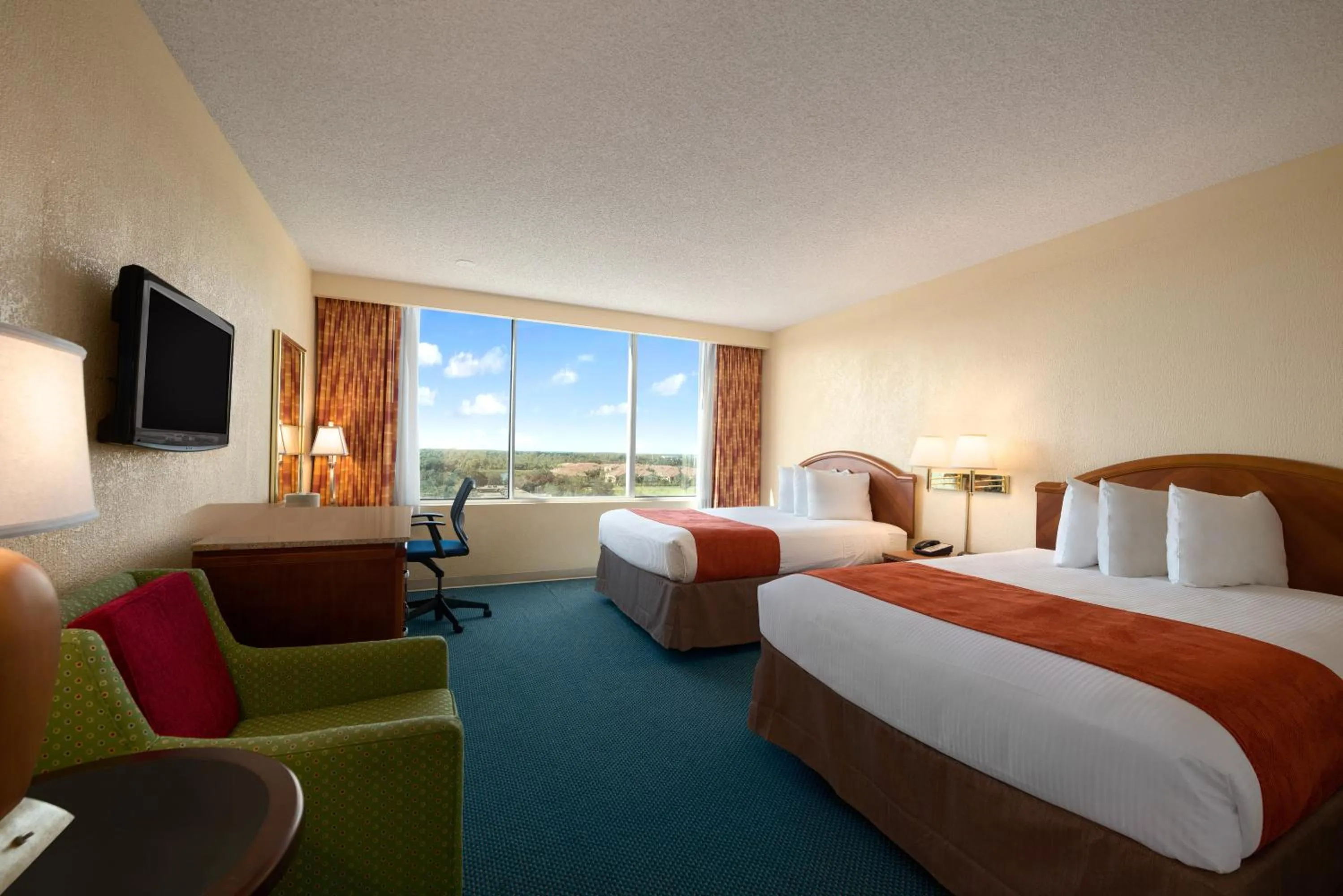 Photo of the whole room, Bed in Ramada by Wyndham Kissimmee Gateway - Free Theme Park Shuttle