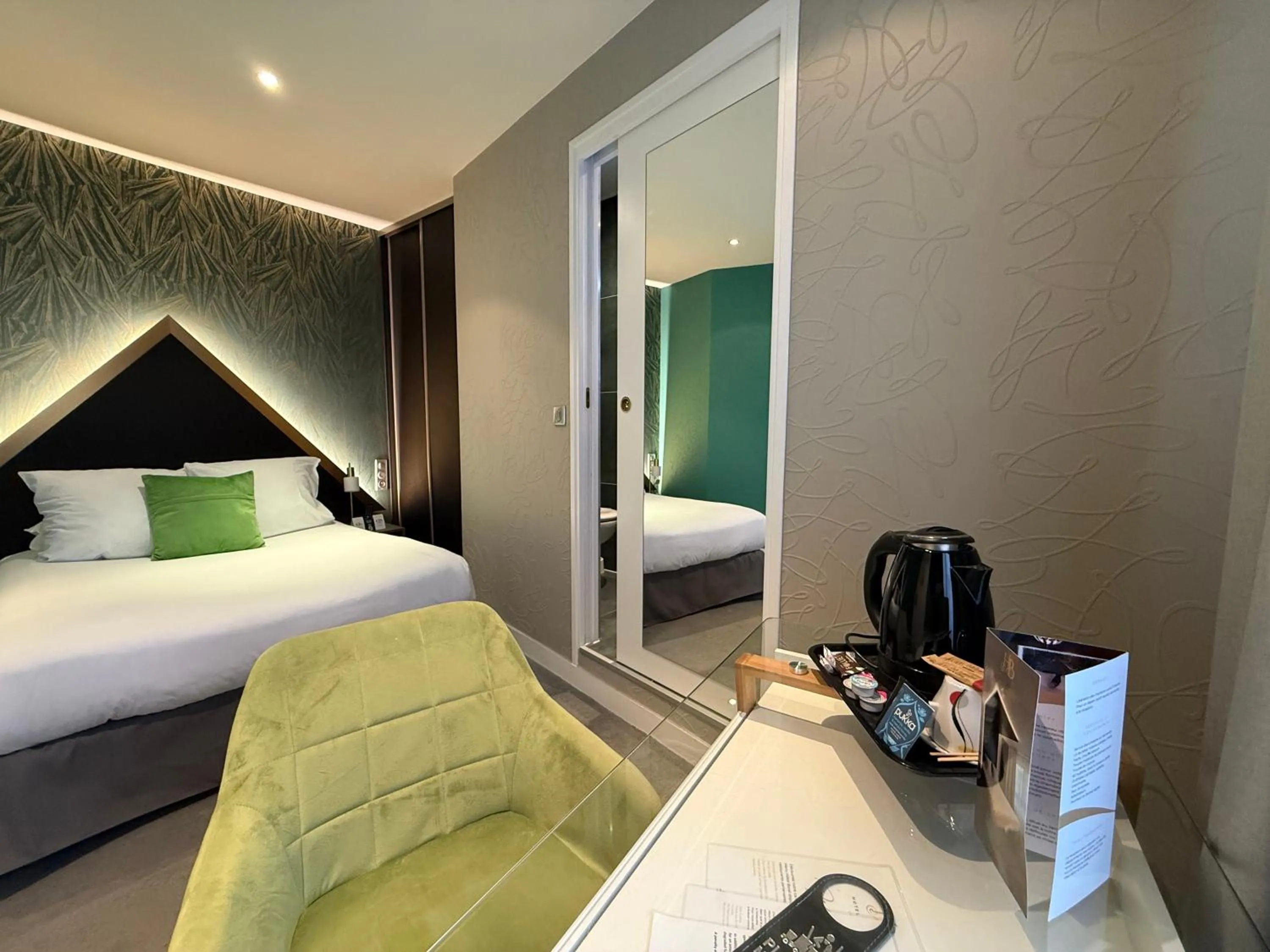 Bed in LOGIS Hôtel Borel