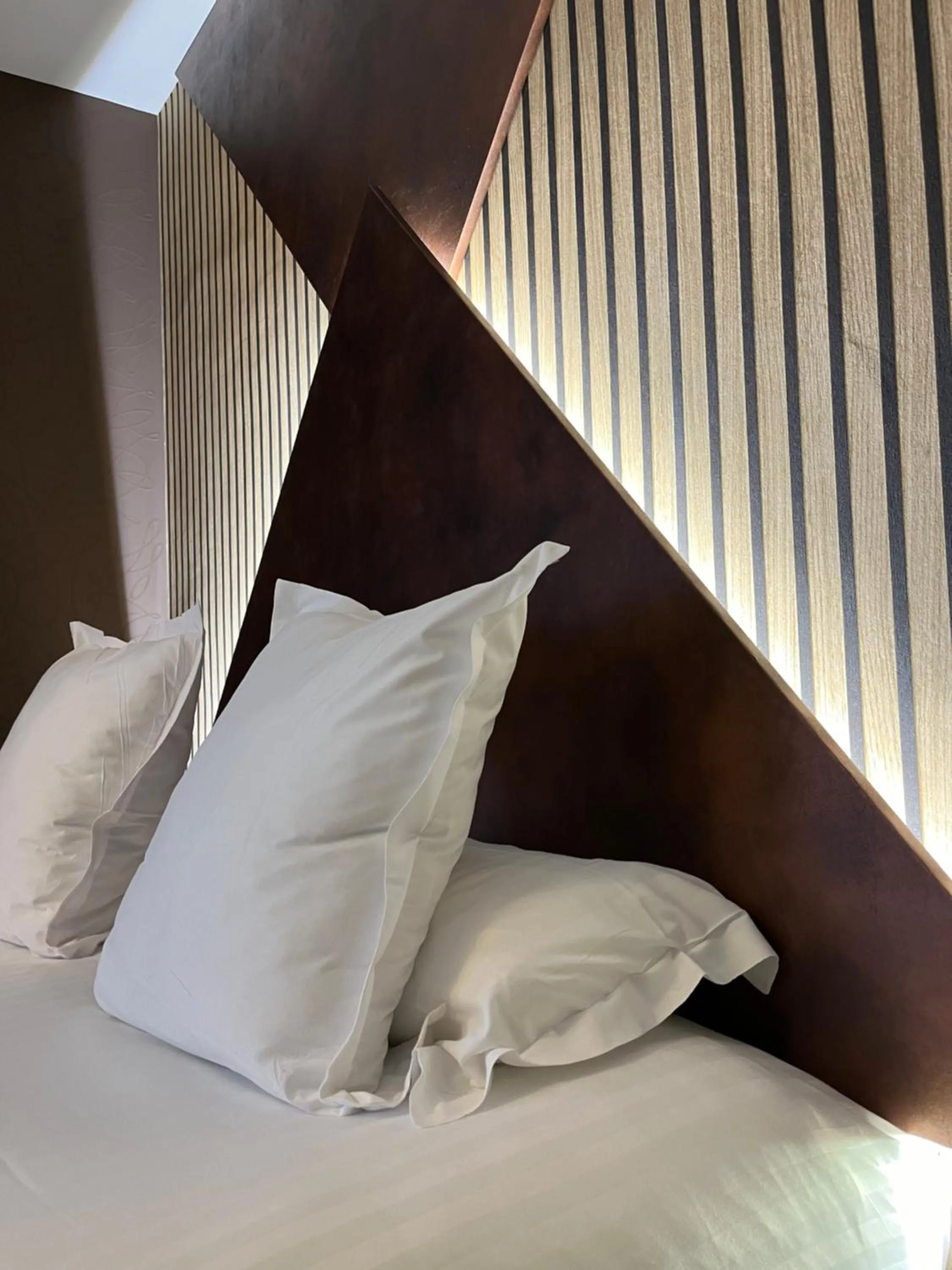 Bed in LOGIS Hôtel Borel