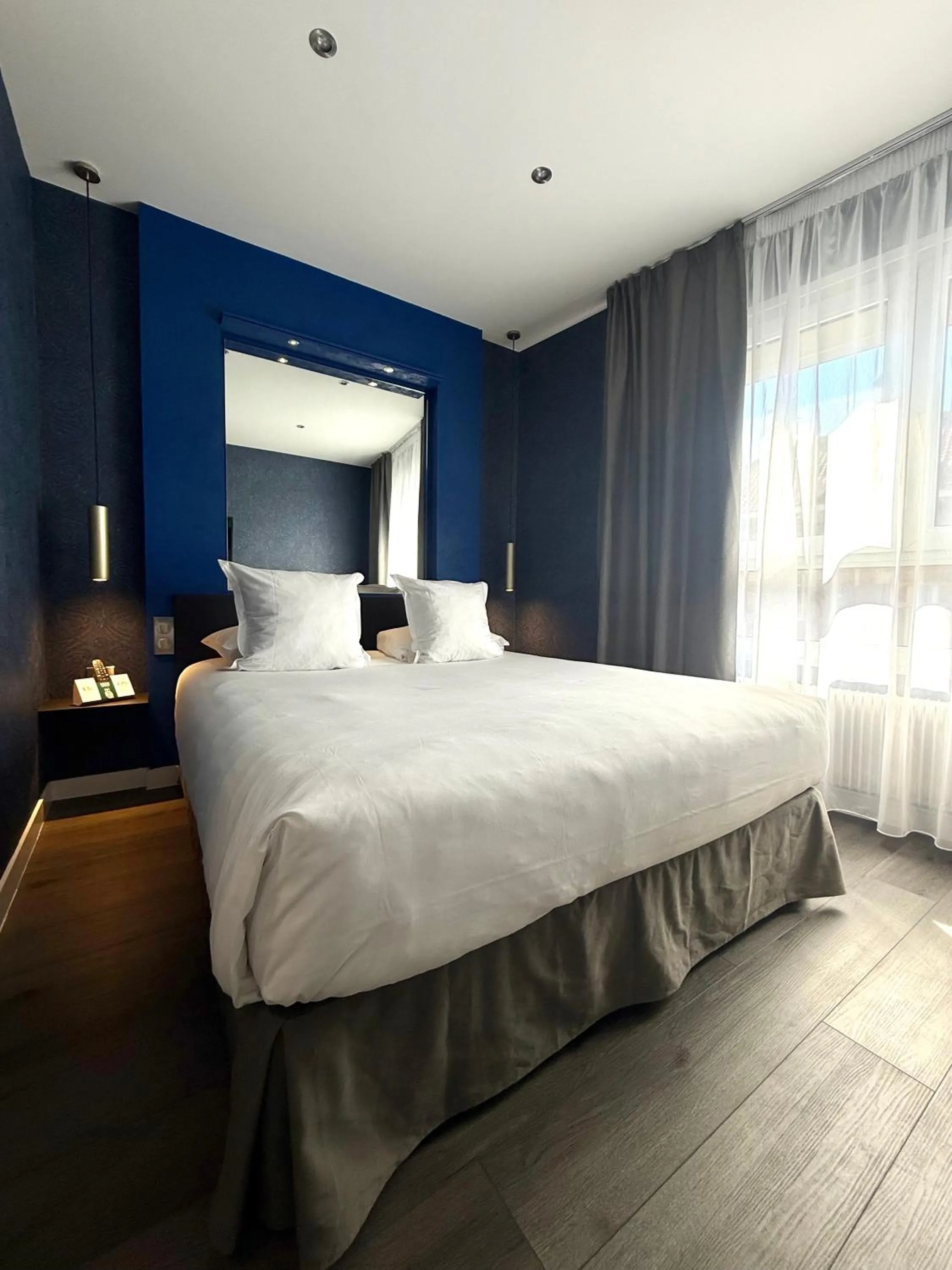 Bed in LOGIS Hôtel Borel