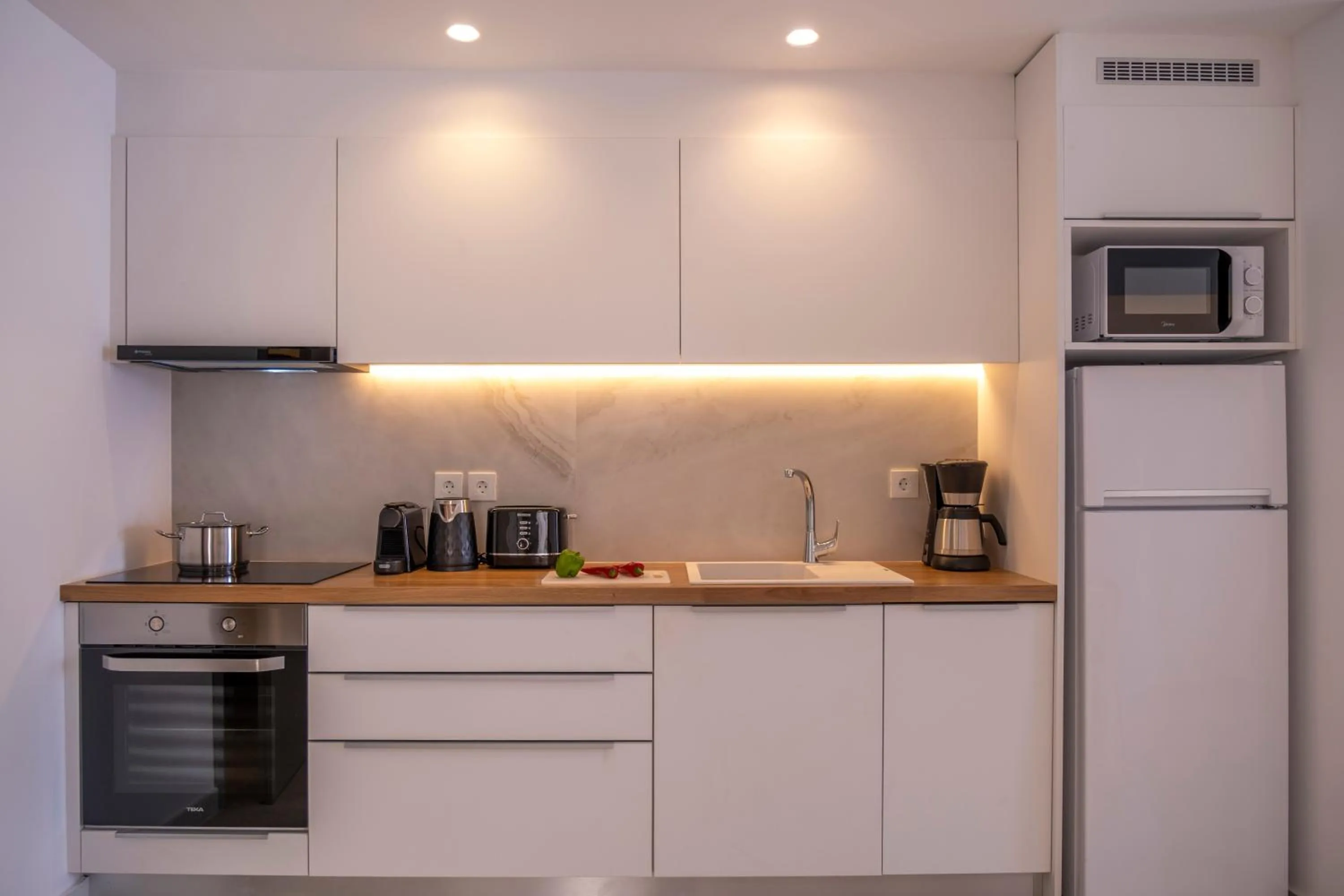 Kitchen or kitchenette in Meli Apartments & Villas