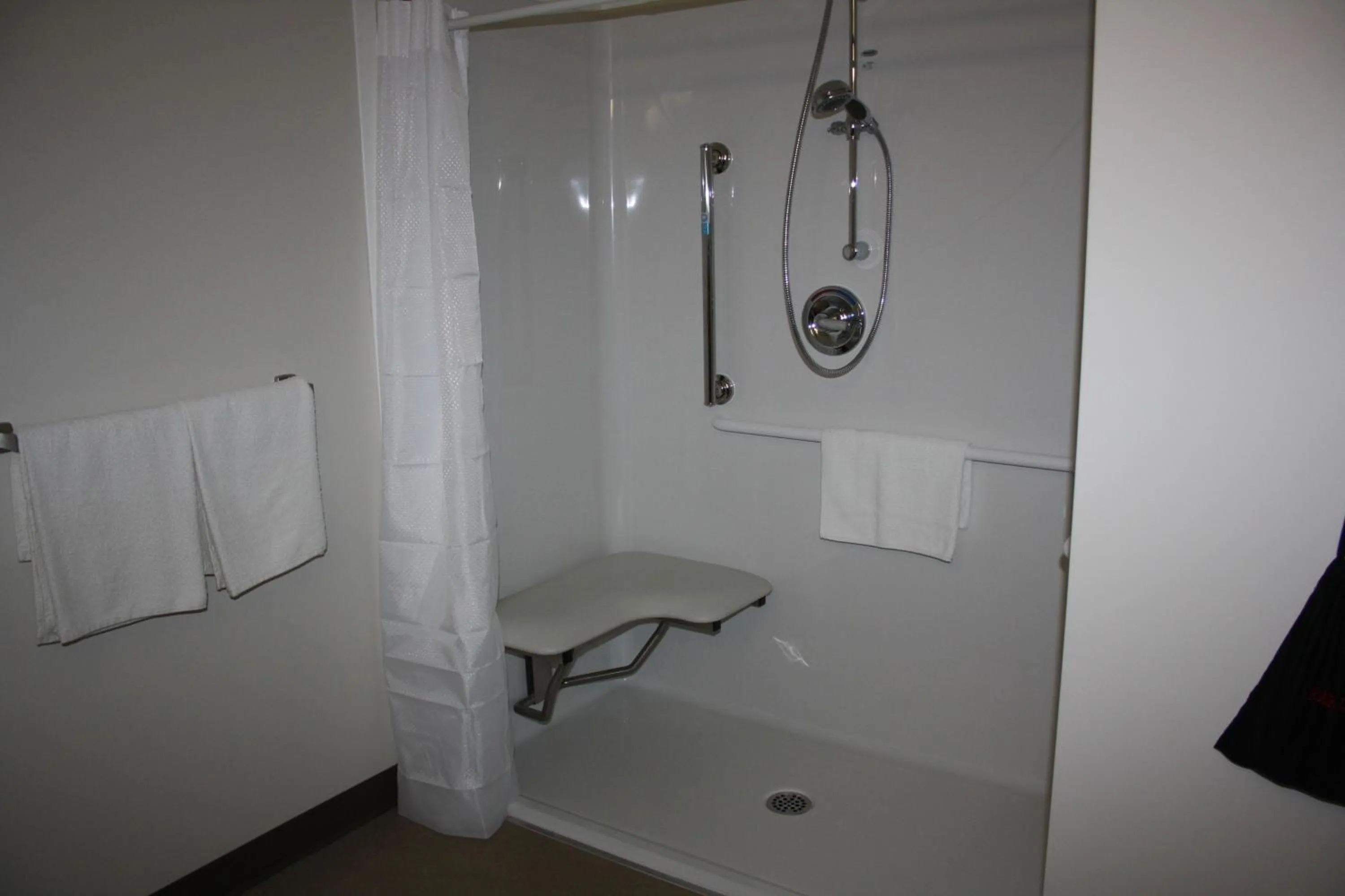 Shower in Crossroads Inn & Suites
