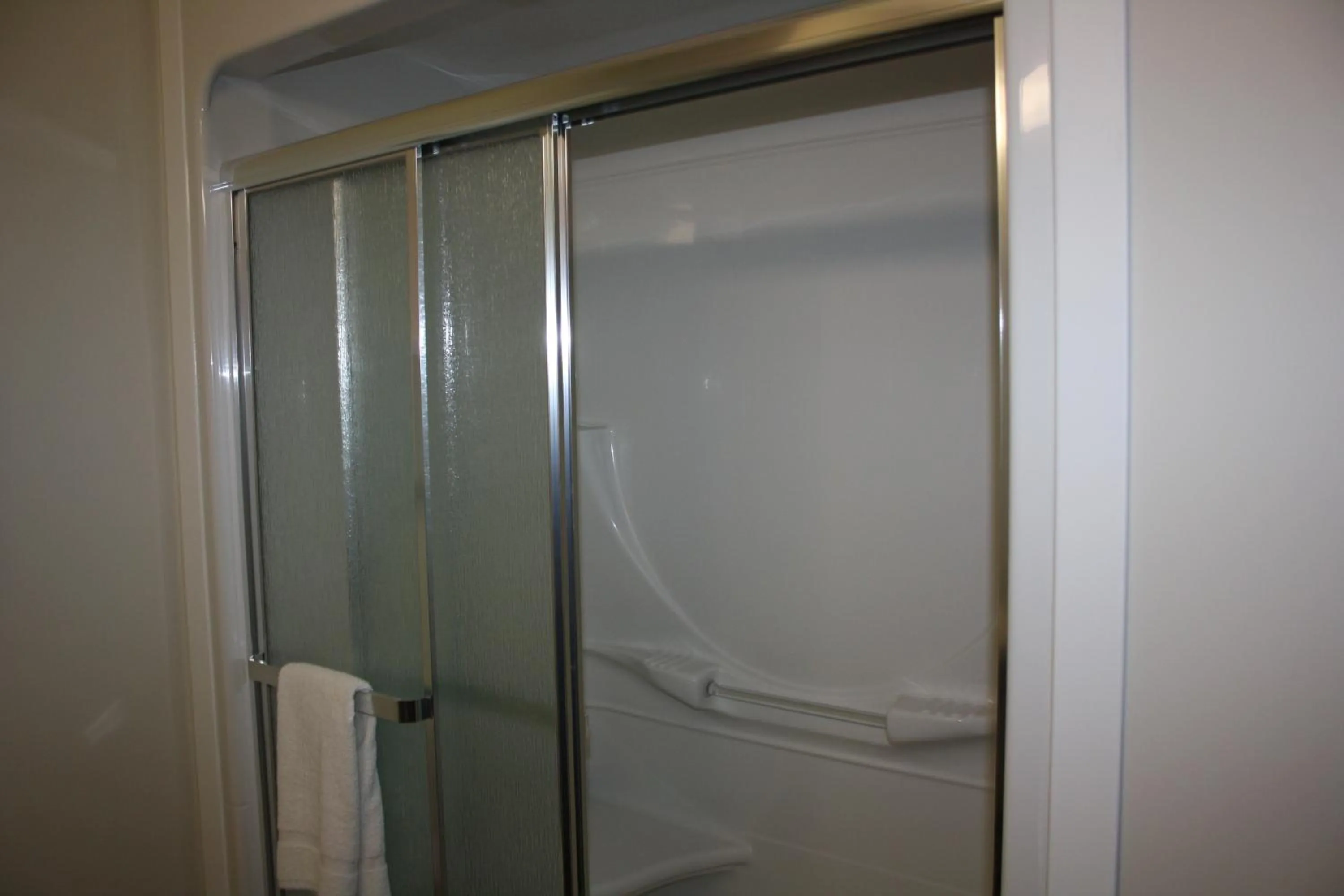 Shower in Crossroads Inn & Suites