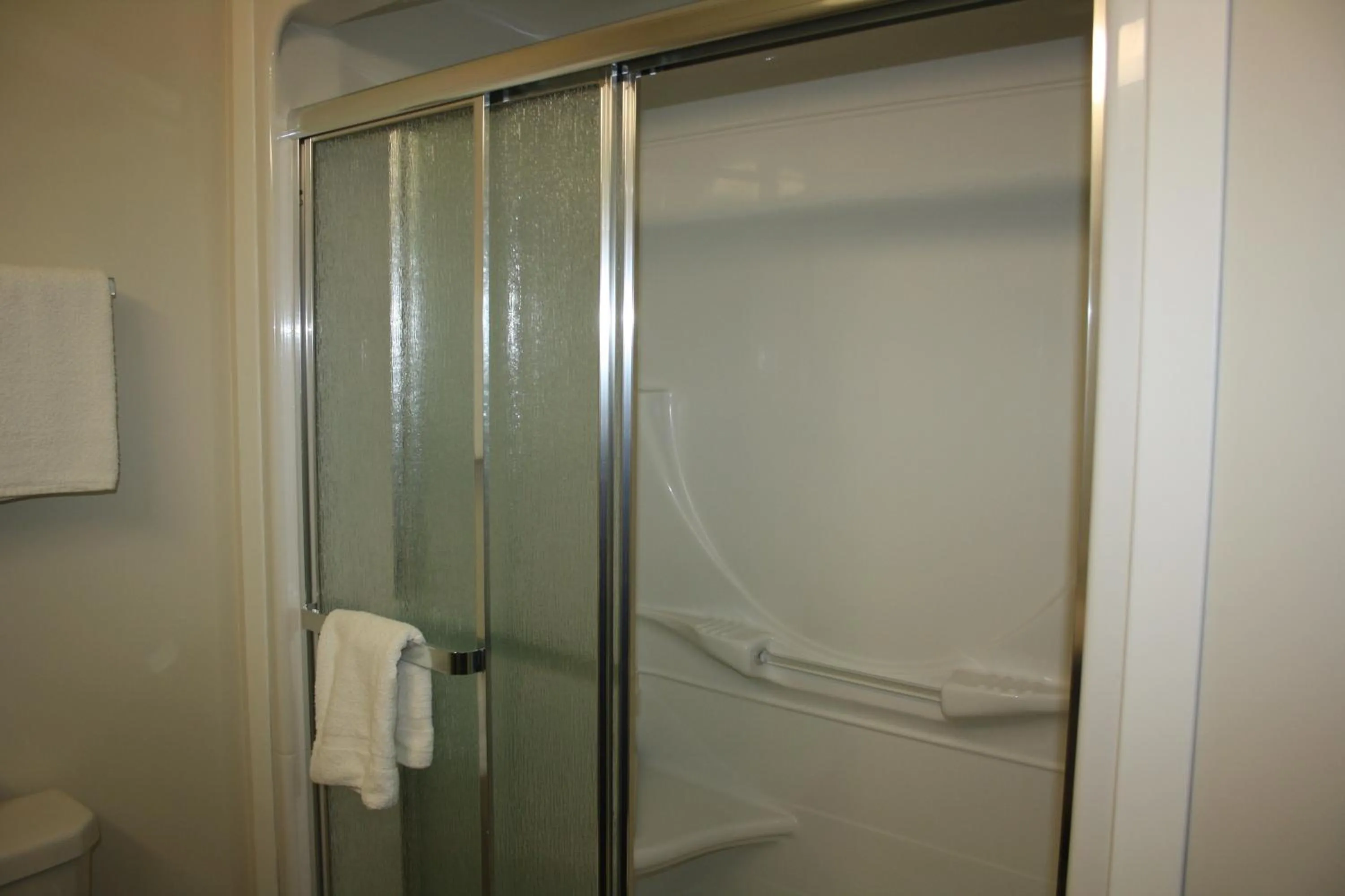 Shower in Crossroads Inn & Suites
