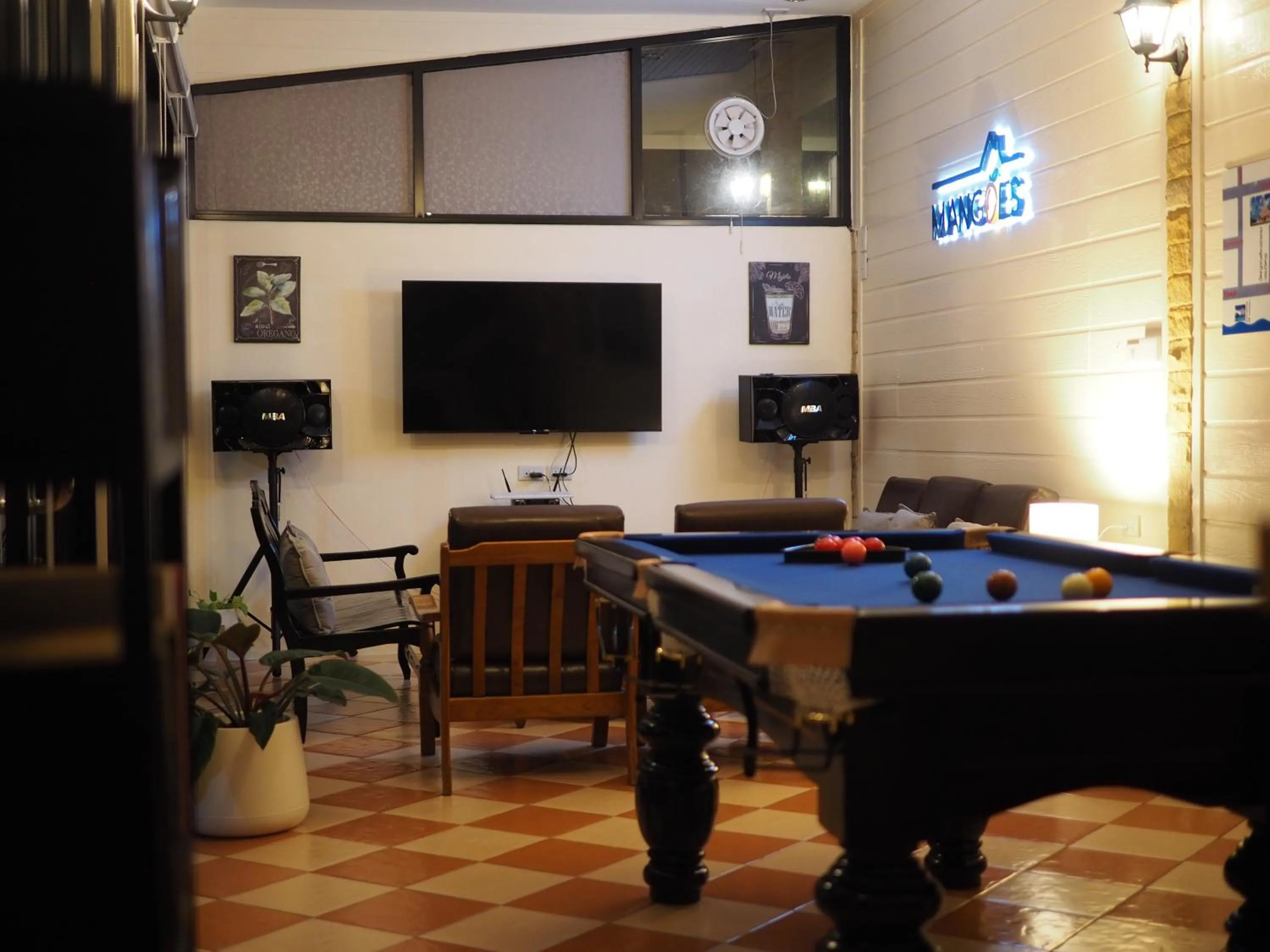 Communal lounge/ TV room in Mangoes Pattaya