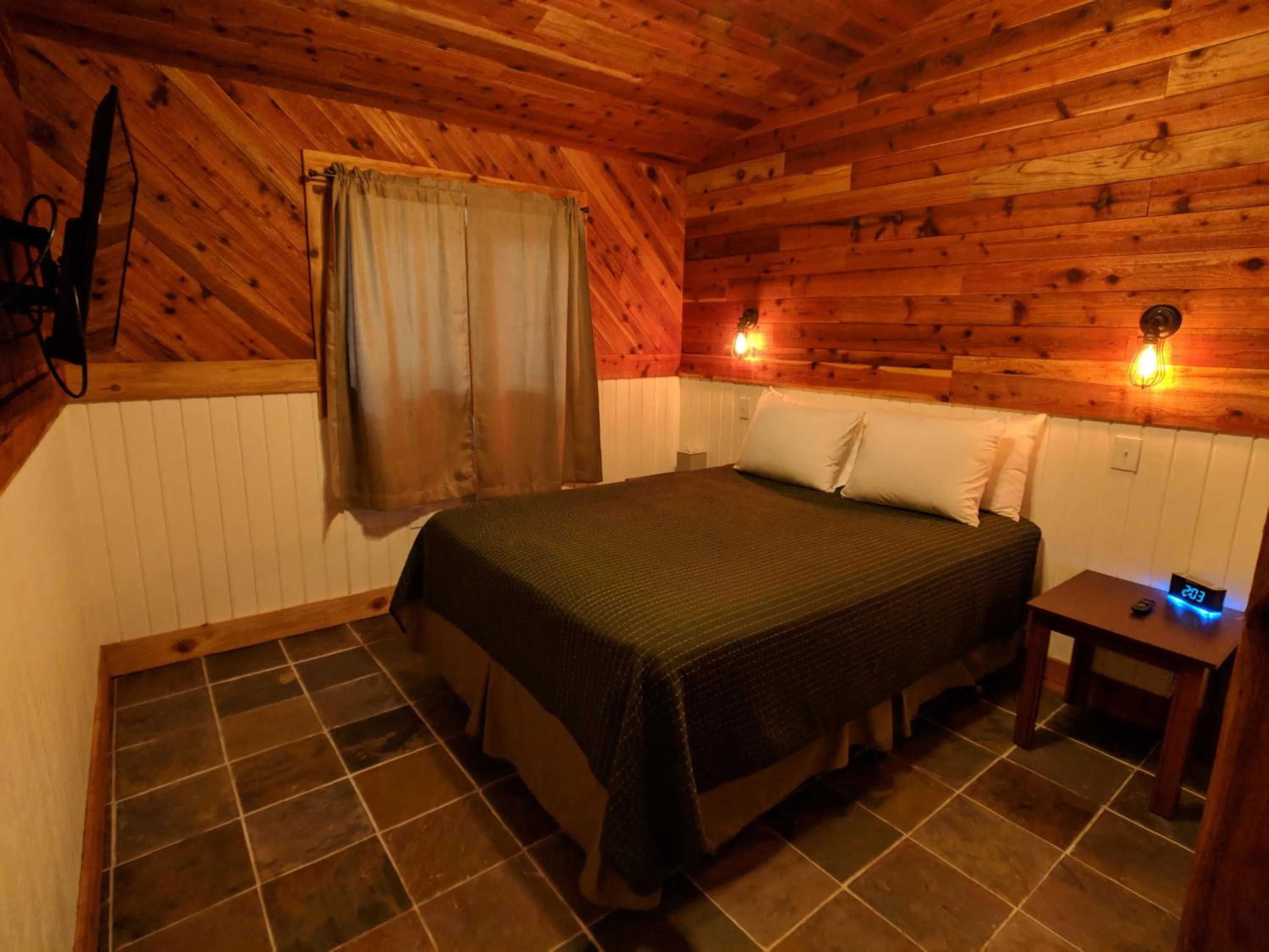 Bed in Emerald Forest Cabins