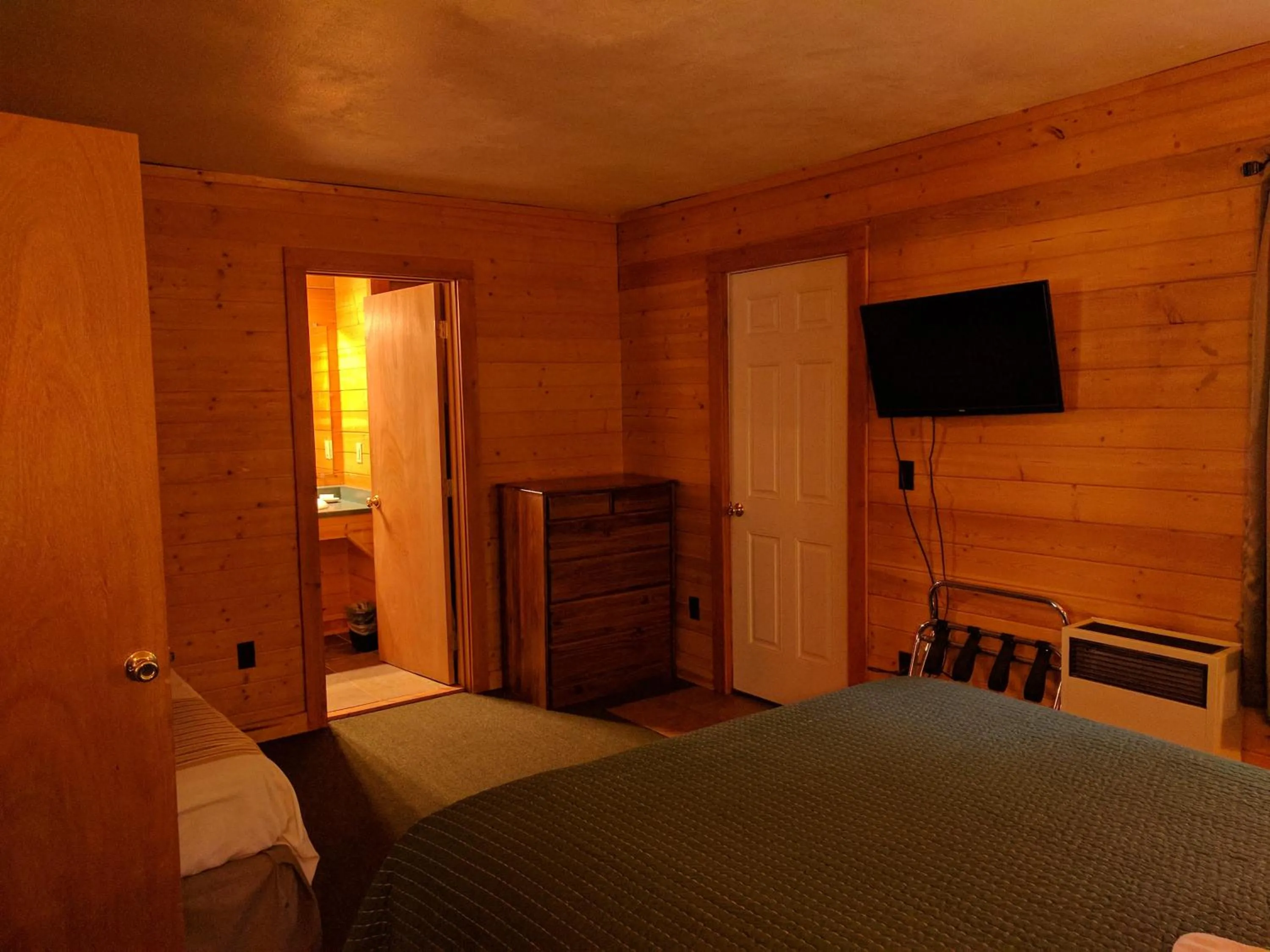 Bed in Emerald Forest Cabins