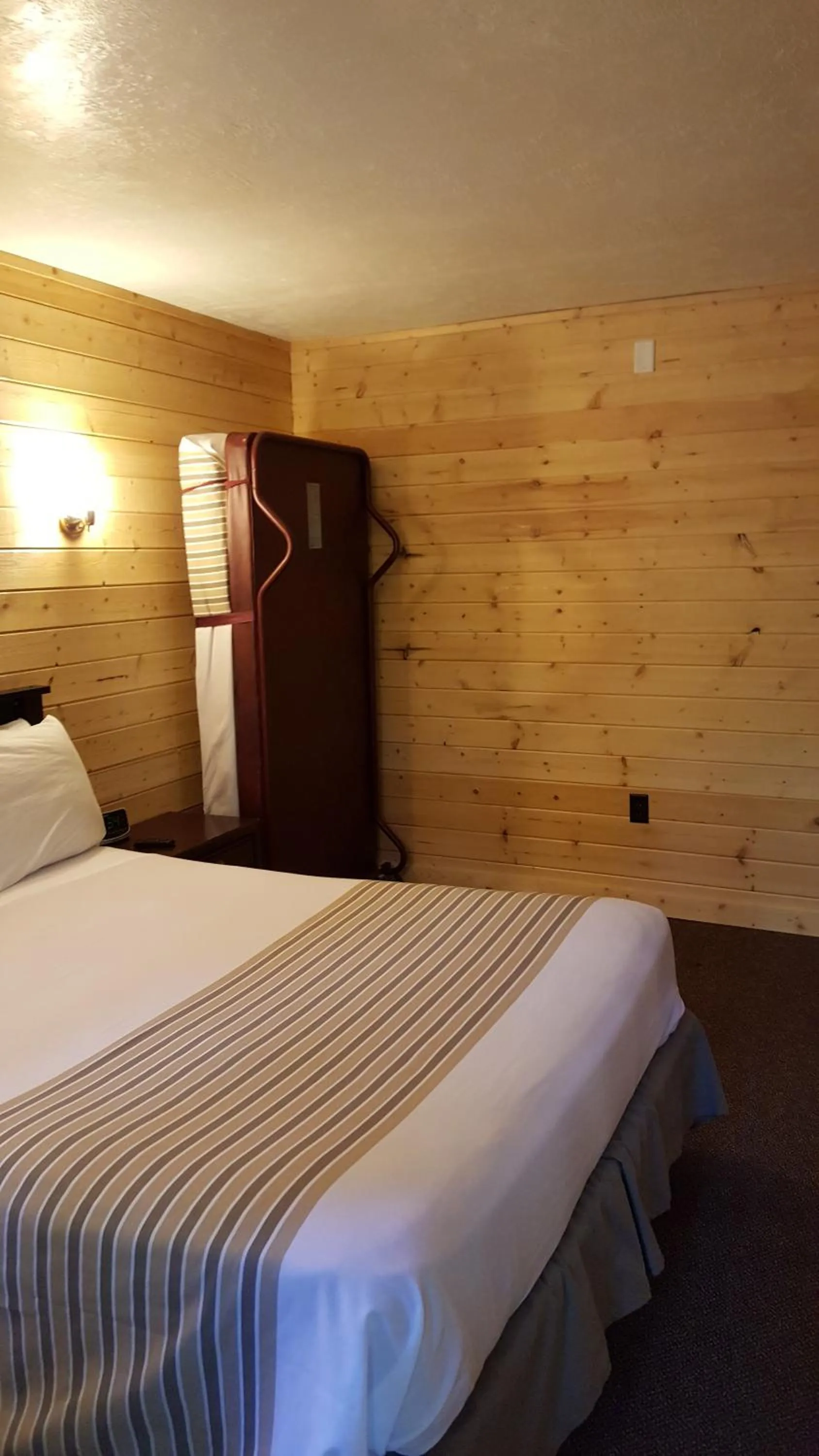 Bed in Emerald Forest Cabins