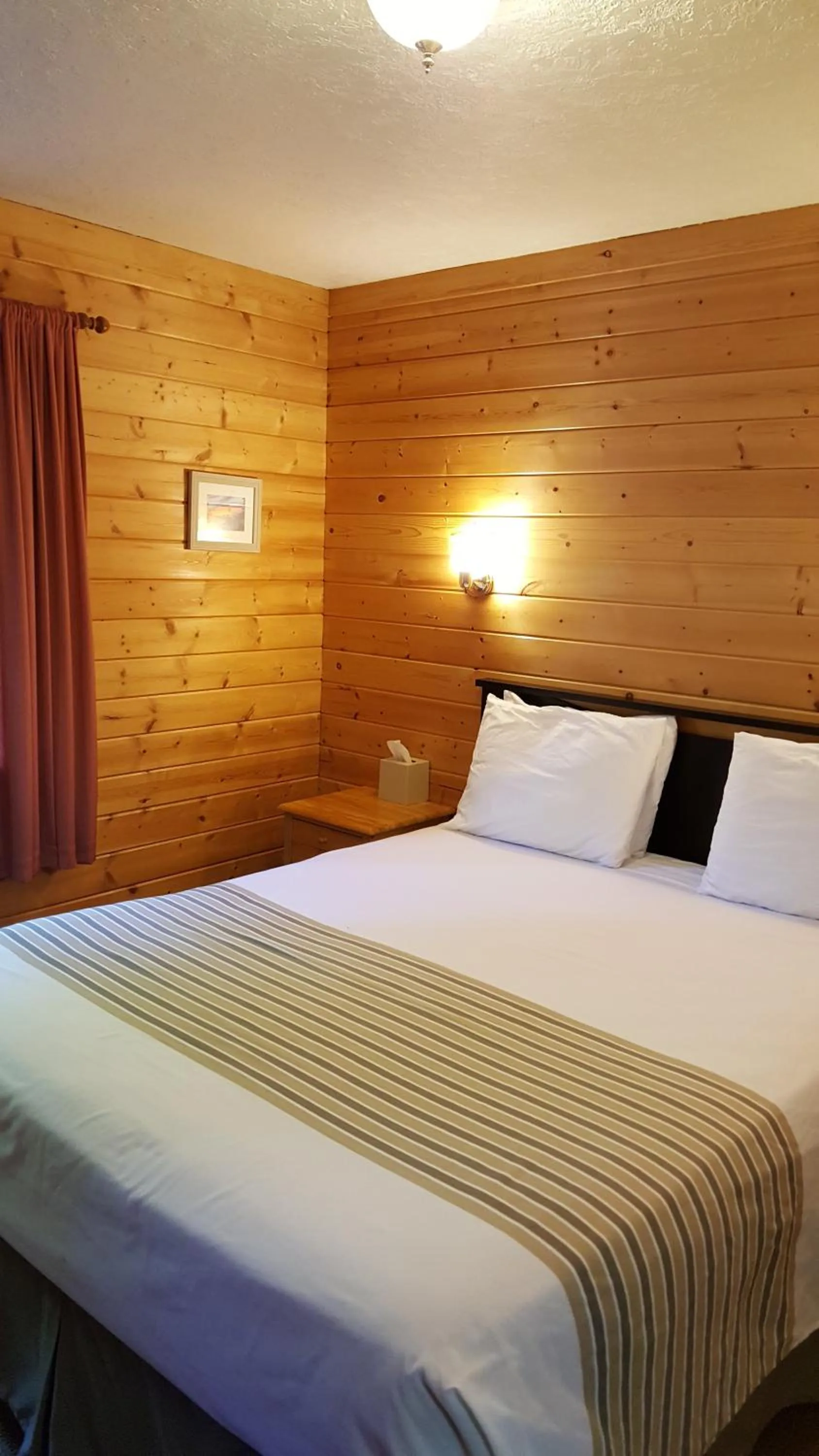 Bed in Emerald Forest Cabins