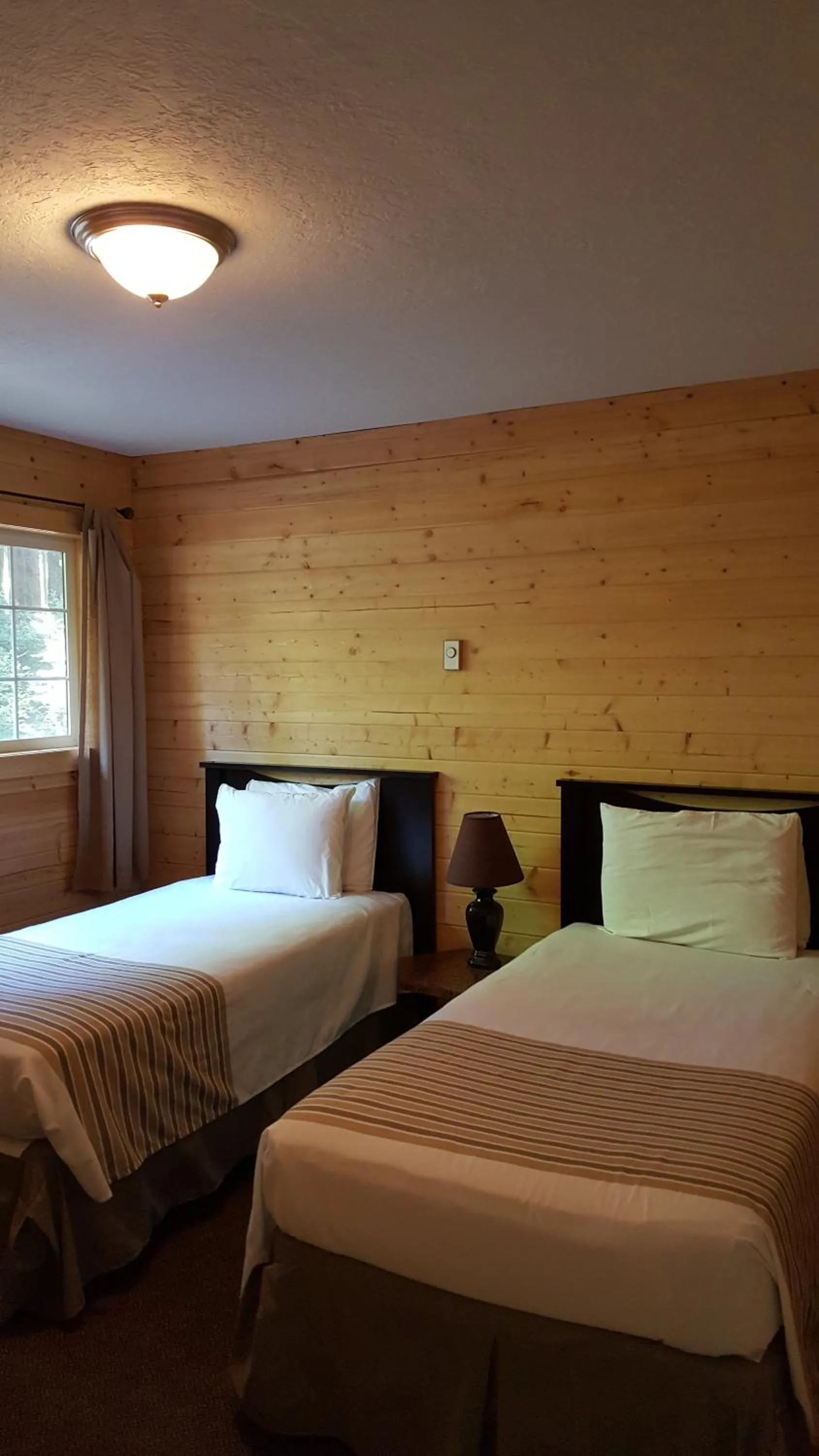 Bed in Emerald Forest Cabins