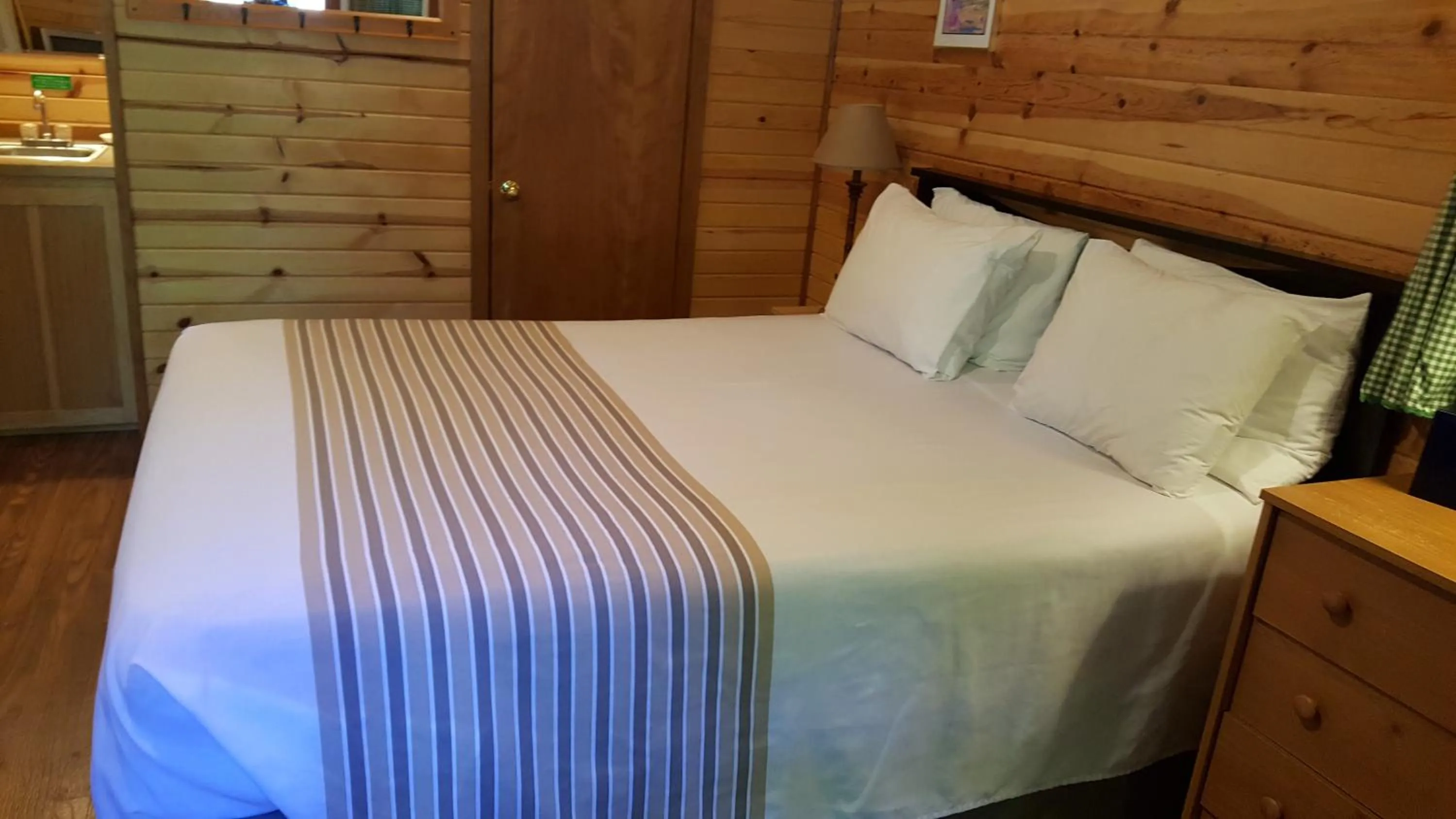 Bed in Emerald Forest Cabins
