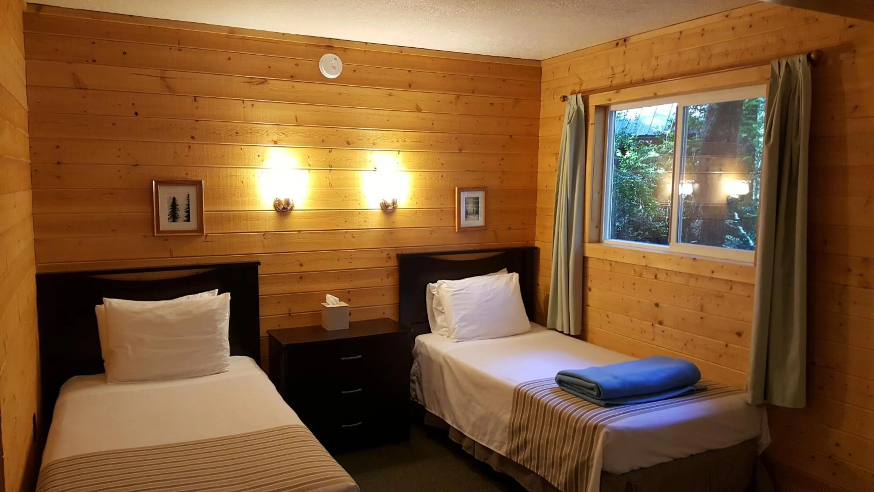 Bed in Emerald Forest Cabins