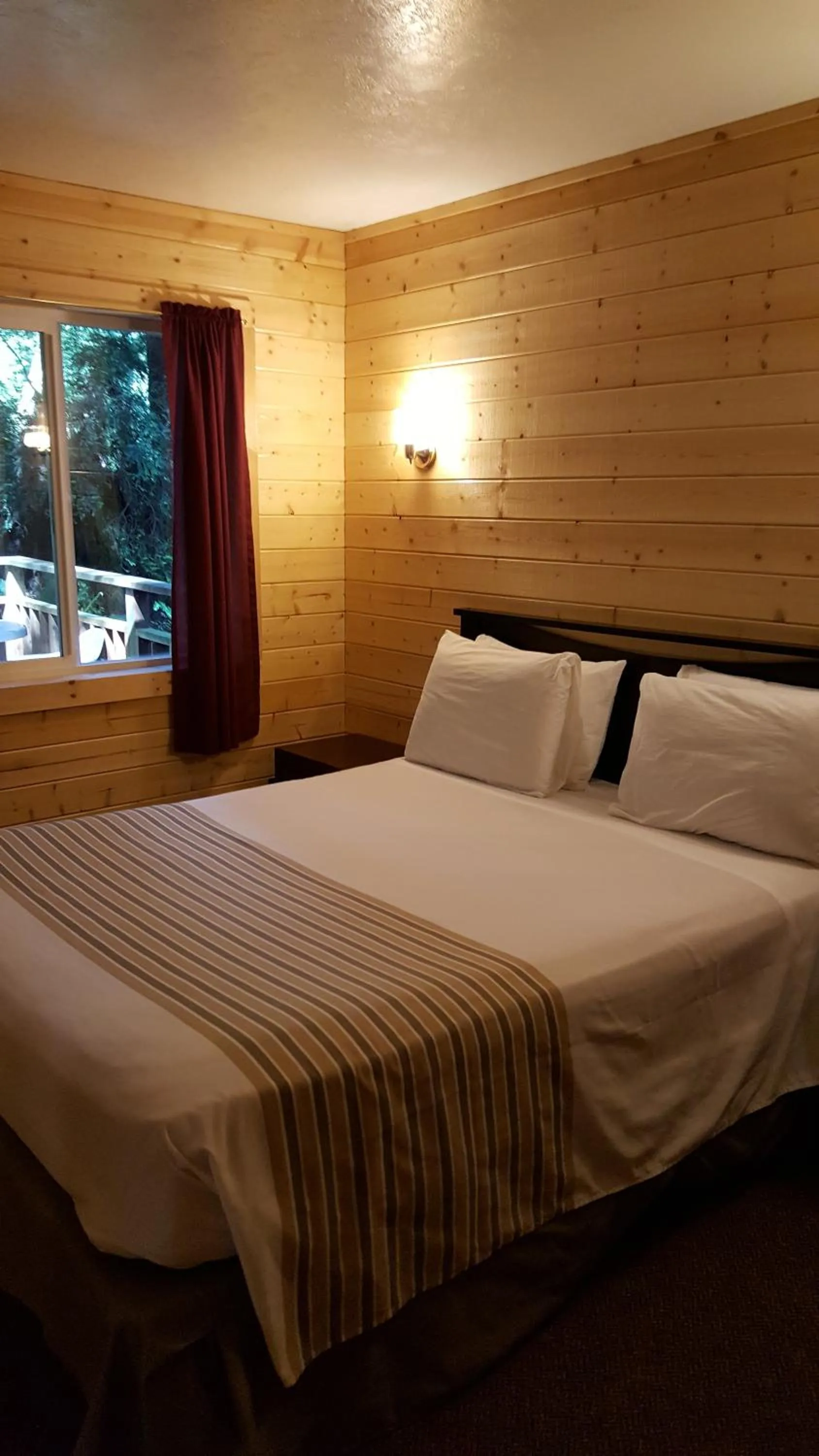 Bed in Emerald Forest Cabins