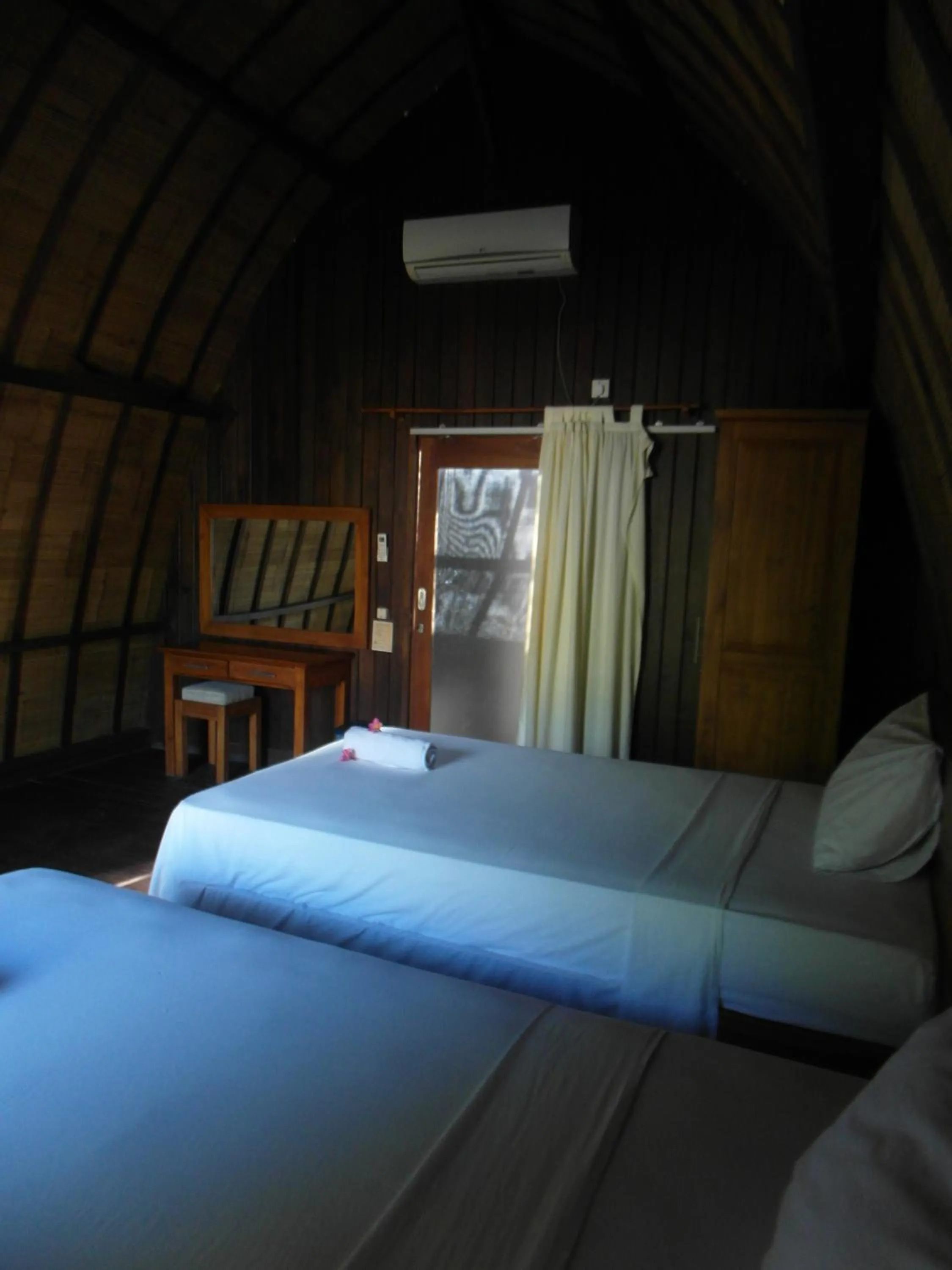 Bed in Melati Cottage