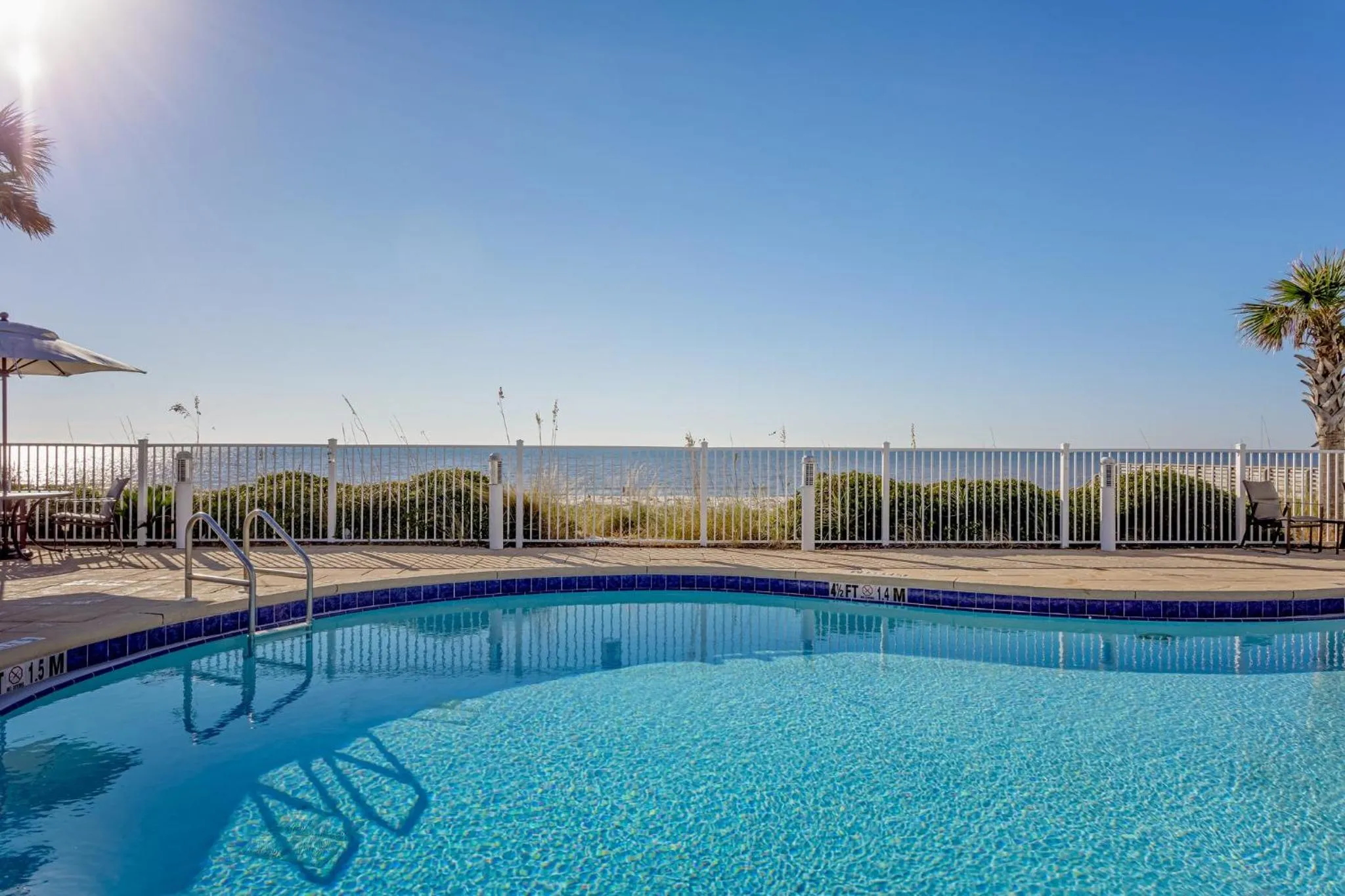 Swimming pool in Holiday Inn Express Pensacola Beach by IHG