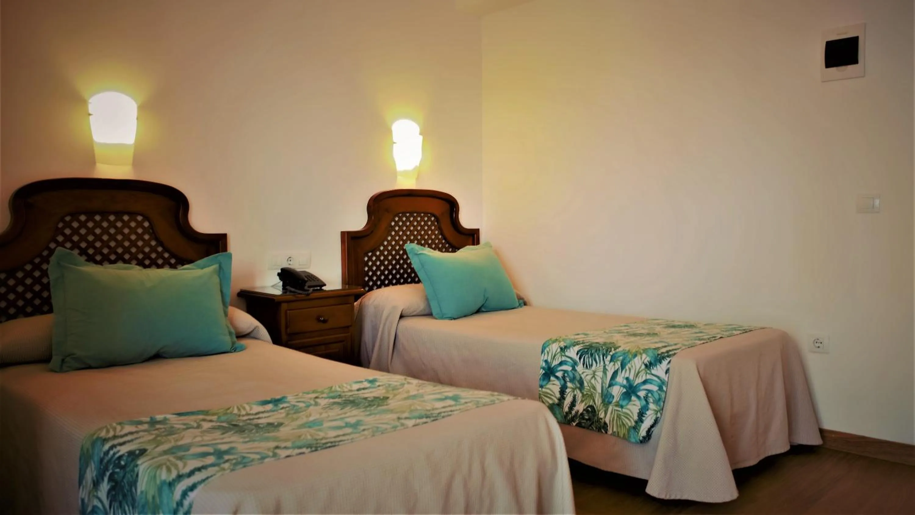 Bed in Hotel Ayamontino