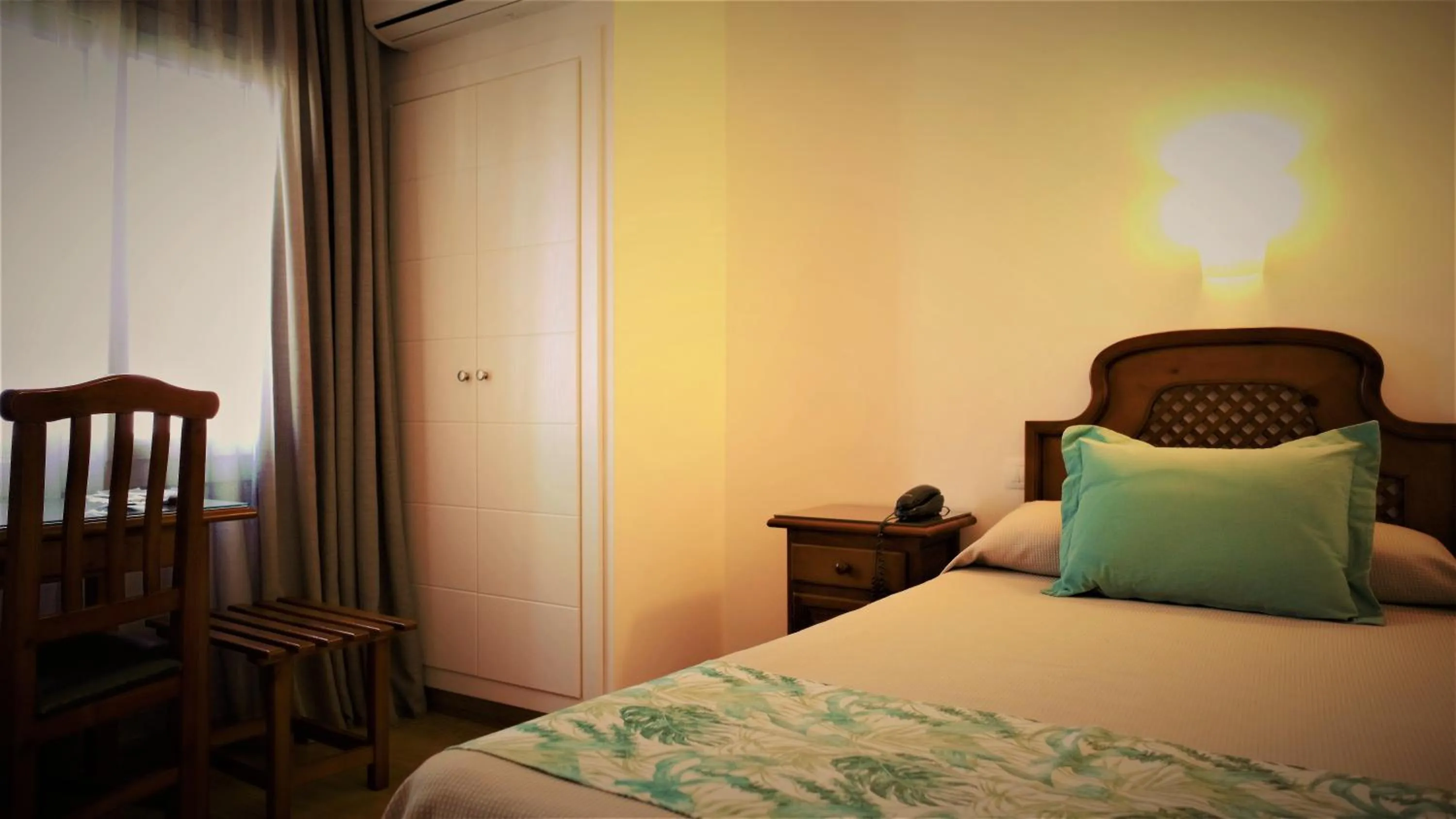 Bed in Hotel Ayamontino