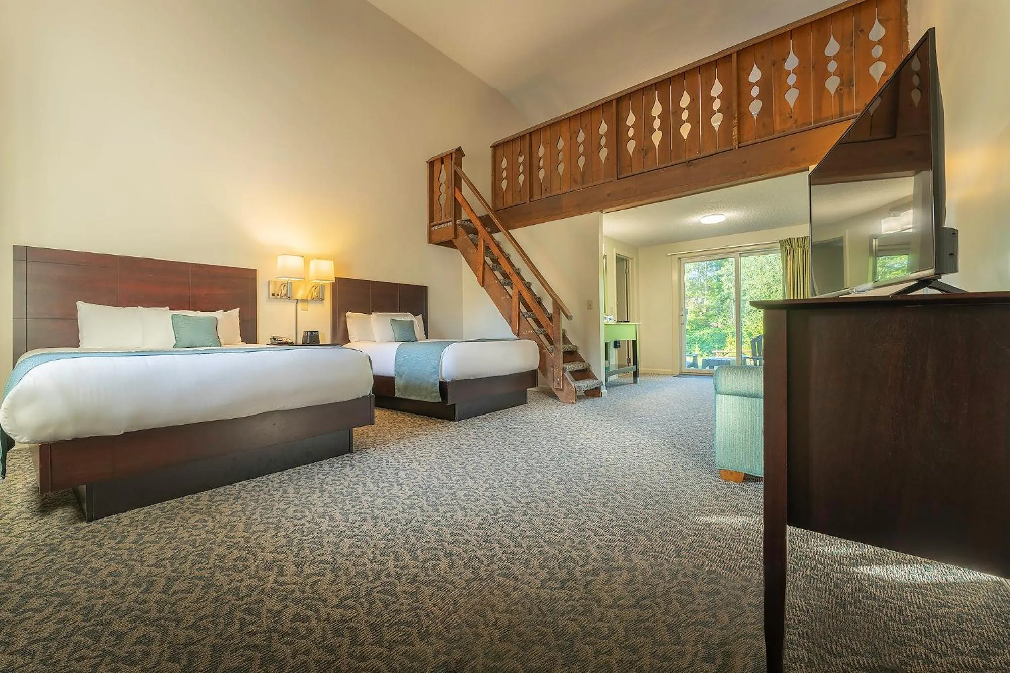 Bed in Sun & Ski Inn and Suites