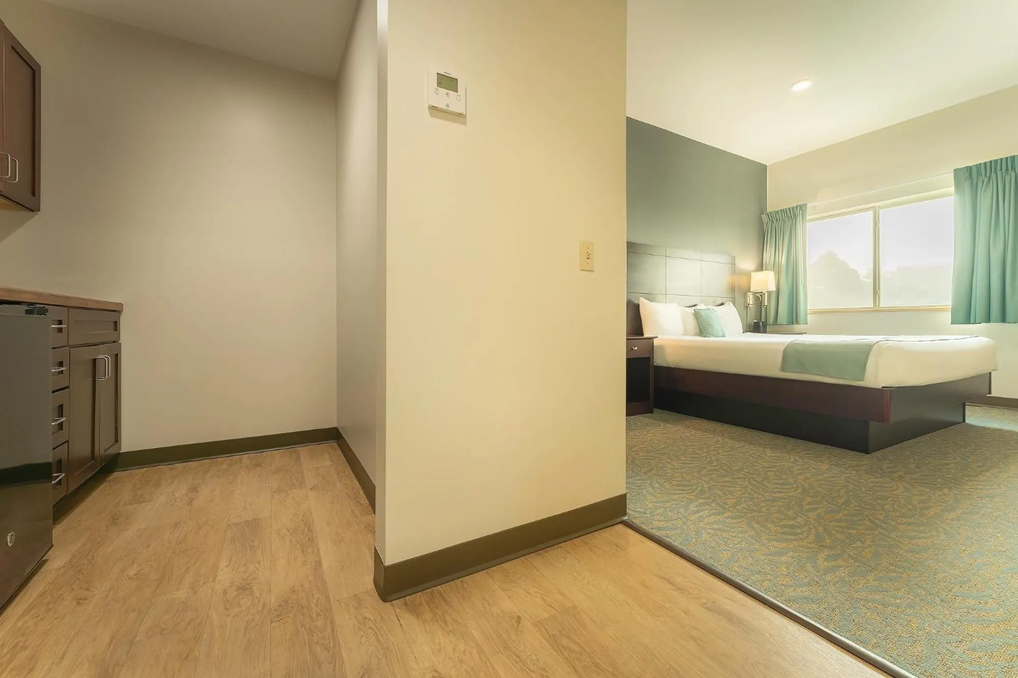 Bed in Sun & Ski Inn and Suites