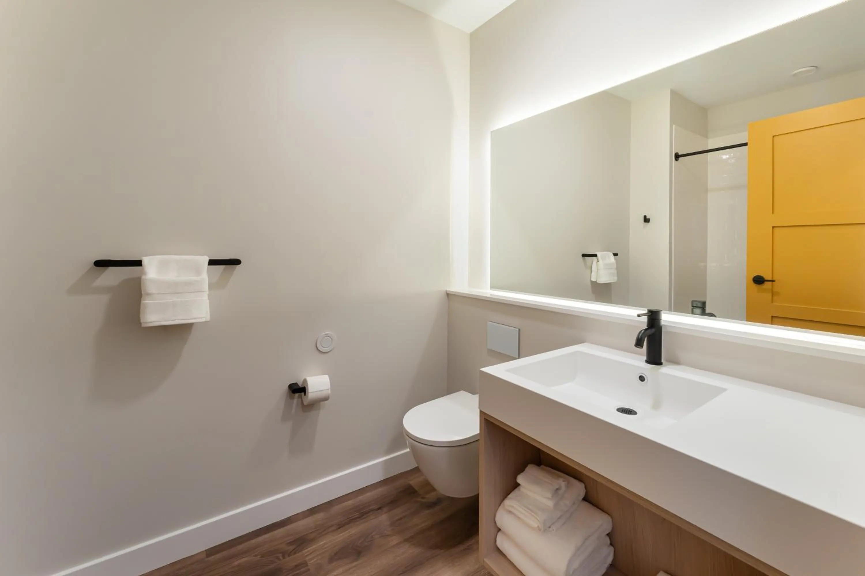 Toilet in Sun & Ski Inn and Suites