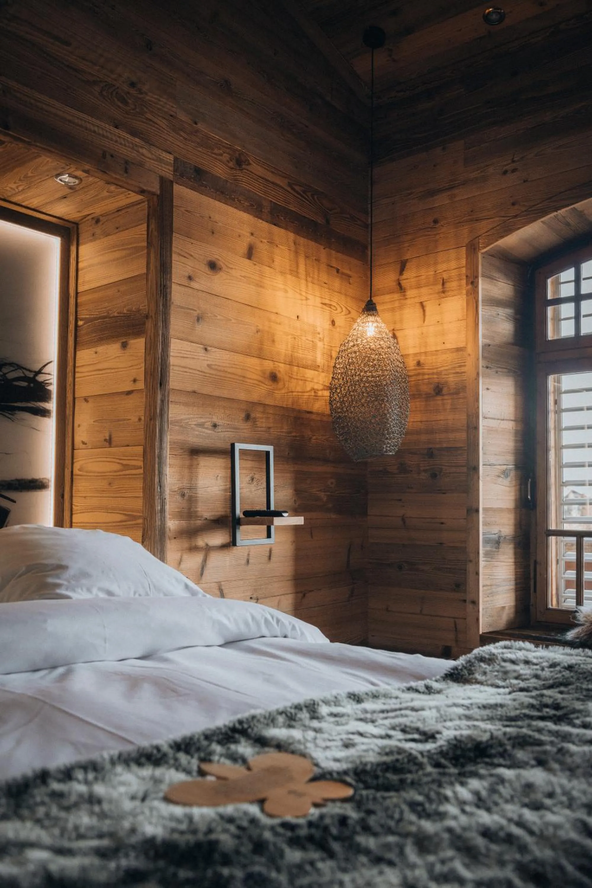 Decorative detail, Bed in Hostellerie du Pas de l'Ours "Relais et Châteaux"