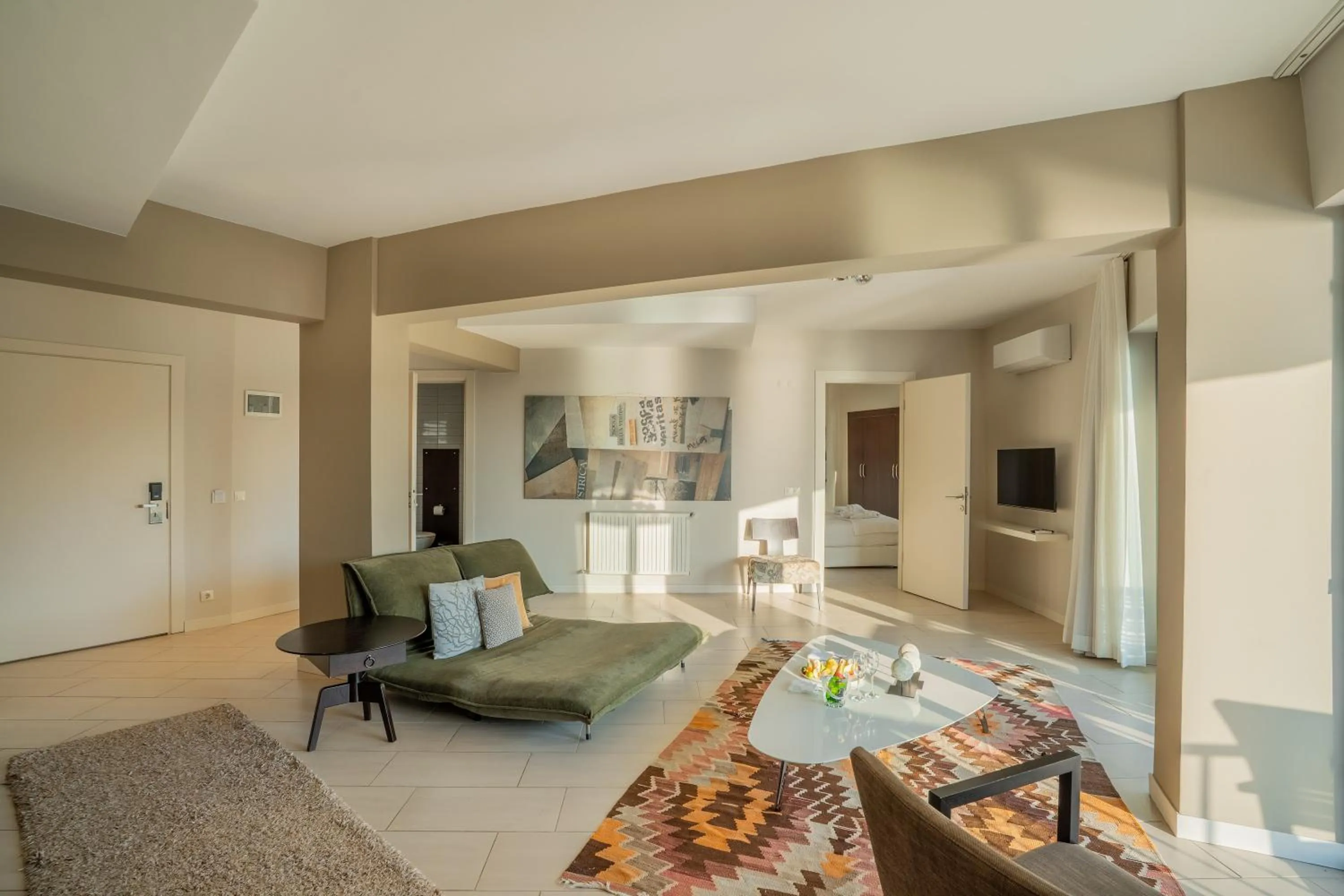 Communal lounge/ TV room in Med-Inn Hotel