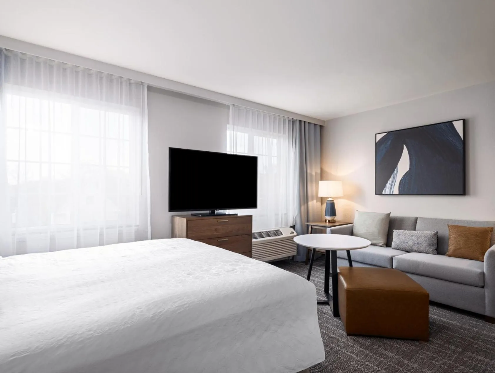 Living room, Bed in Staybridge Suites Rochester University by IHG