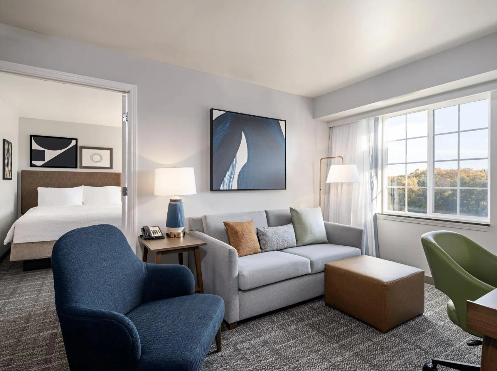 Living room, Bed in Staybridge Suites Rochester University by IHG