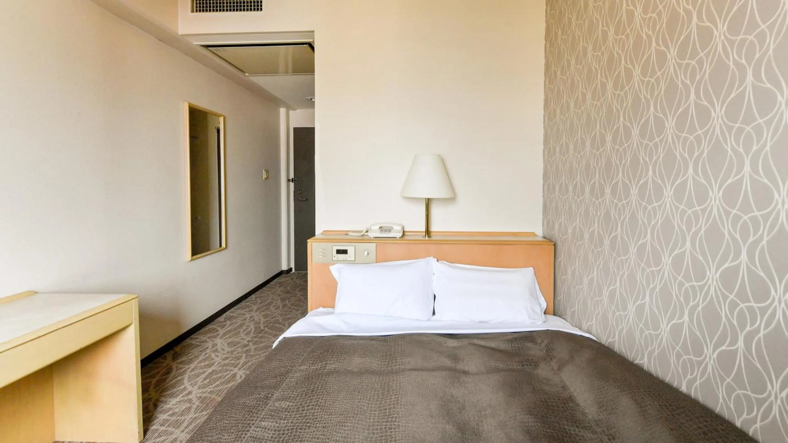 Bed in Okazaki Daiichi Hotel