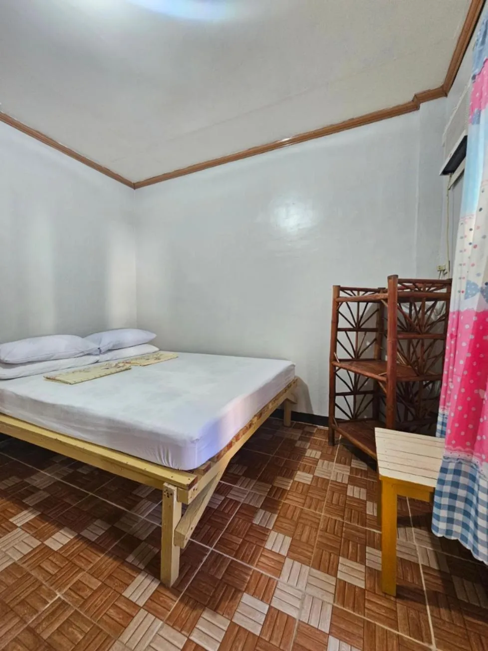 Bed in Bohol Sea Breeze Cottages and Resort