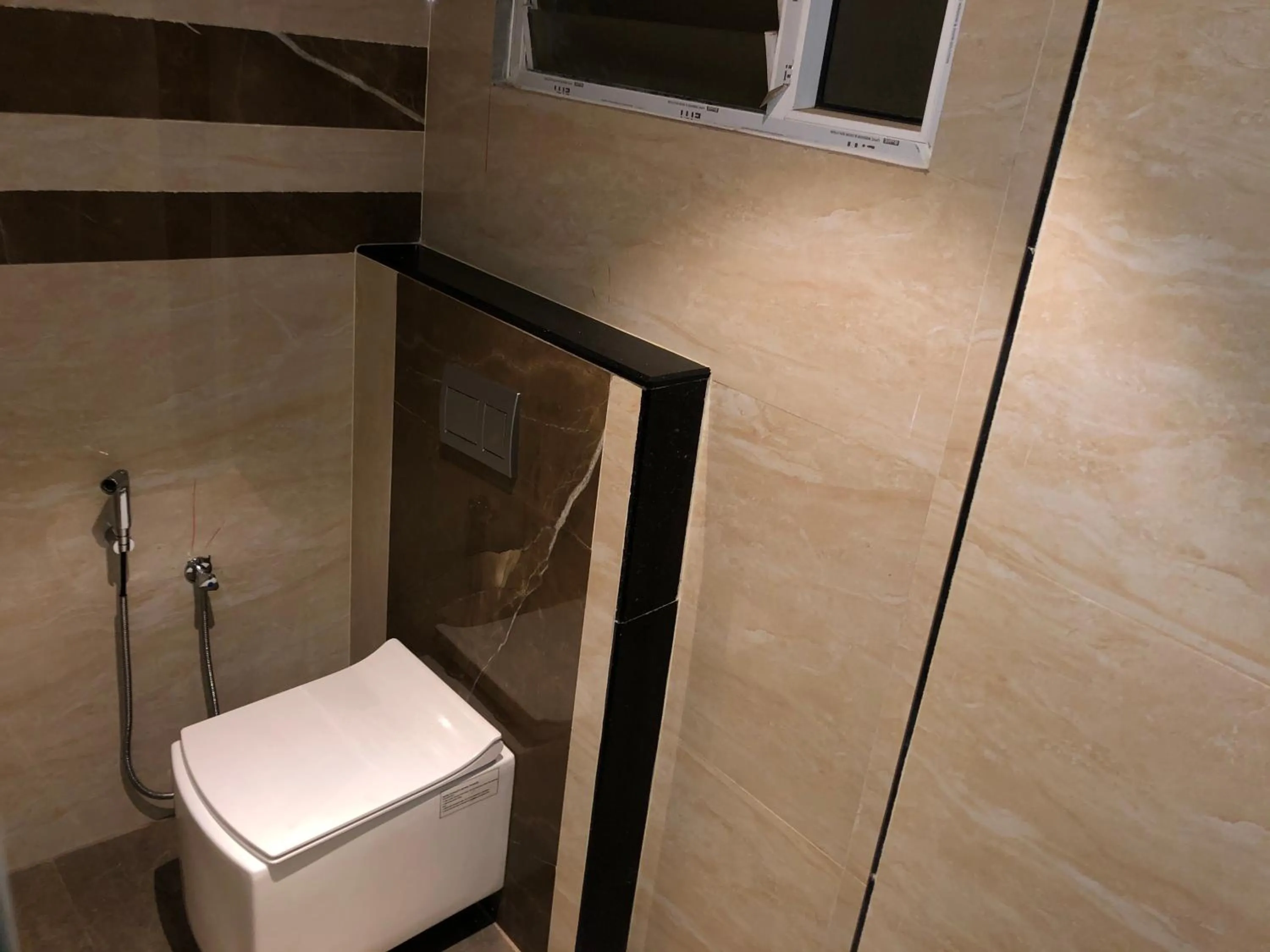 Toilet in New Cape Hotel