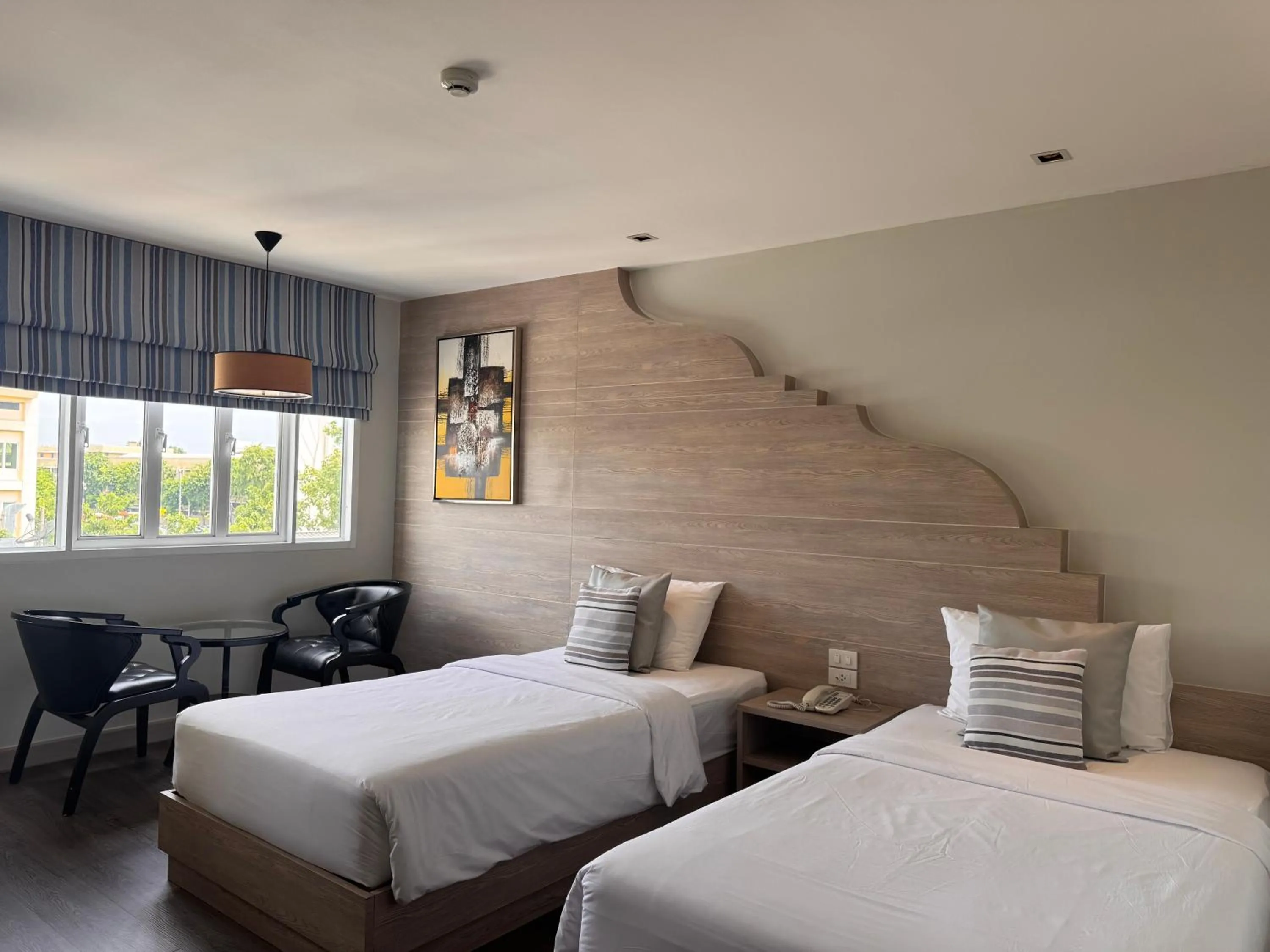 Bed in Methavalai Residence Hotel