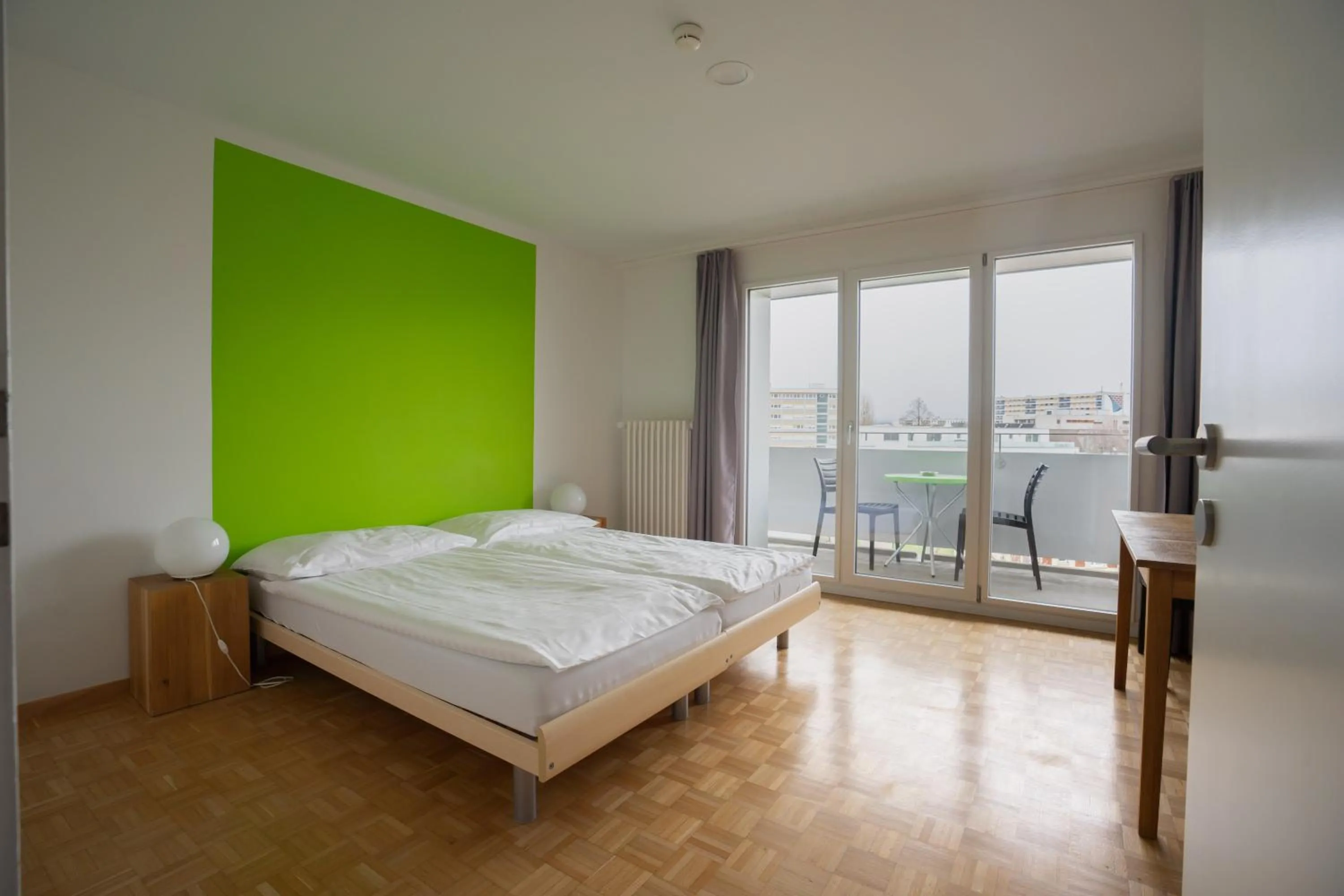 Double Room with Balcony - single occupancy in Nyon Hostel