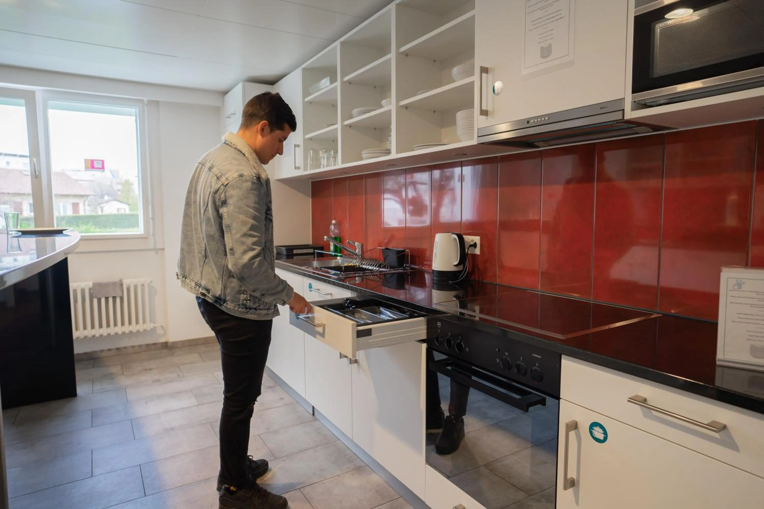 Communal kitchen in Nyon Hostel