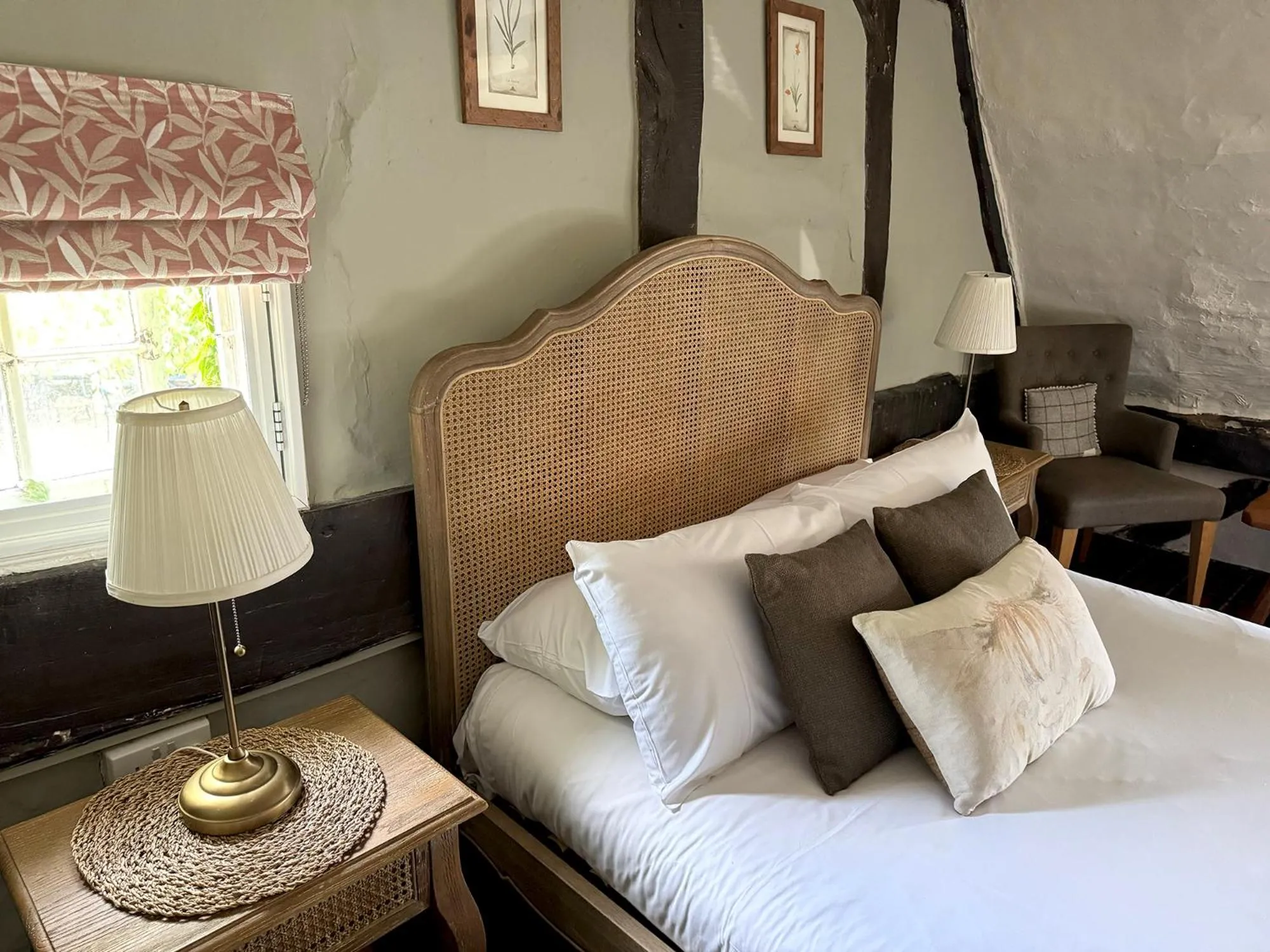 Bed in Thatched Cottage Hotel