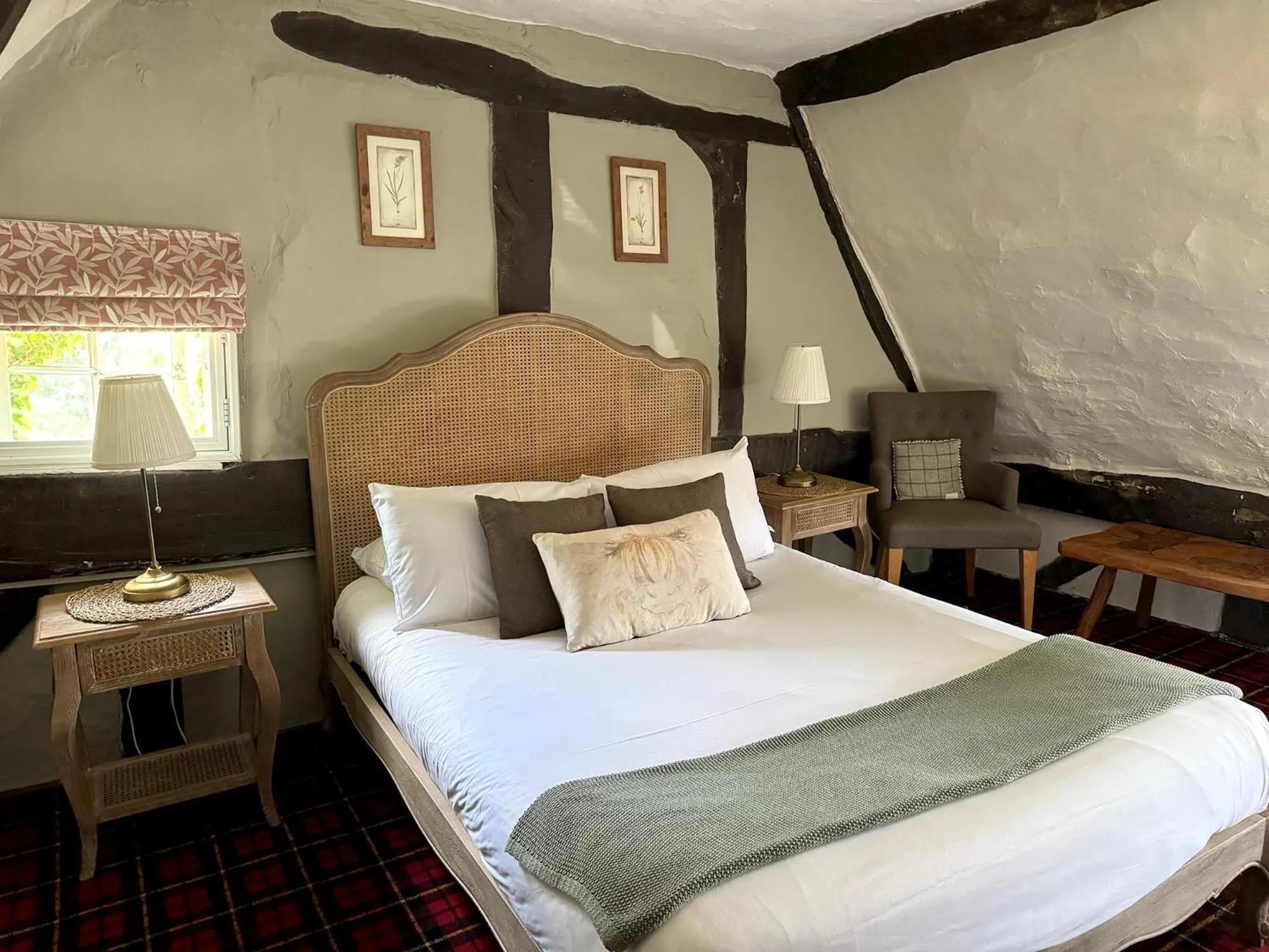 Bed in Thatched Cottage Hotel