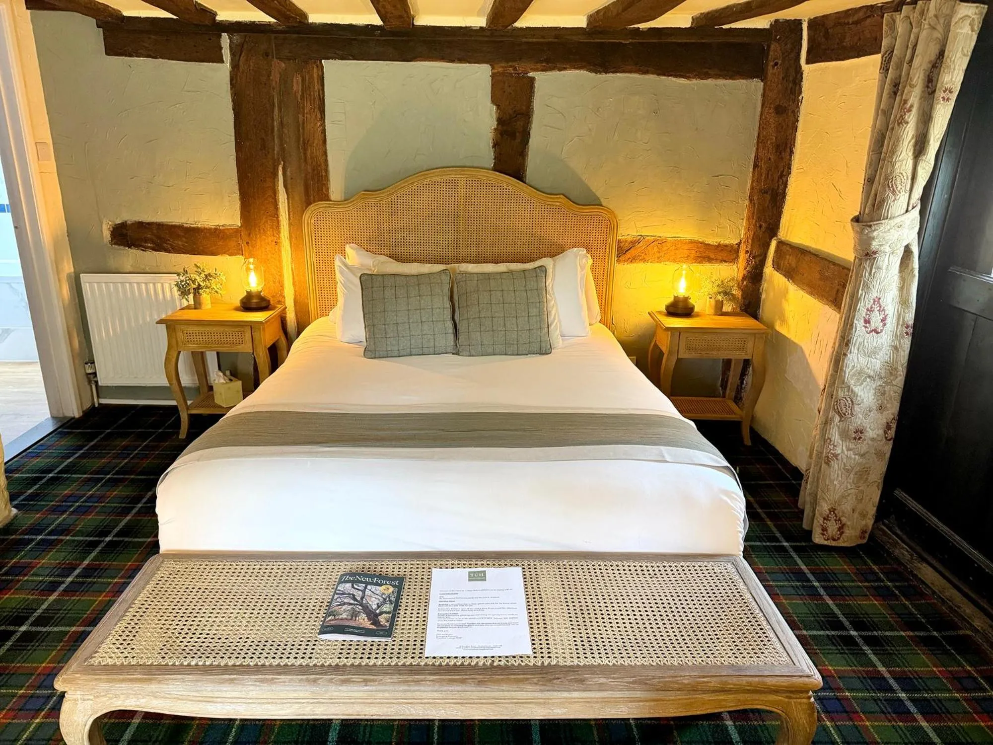 Bed in Thatched Cottage Hotel