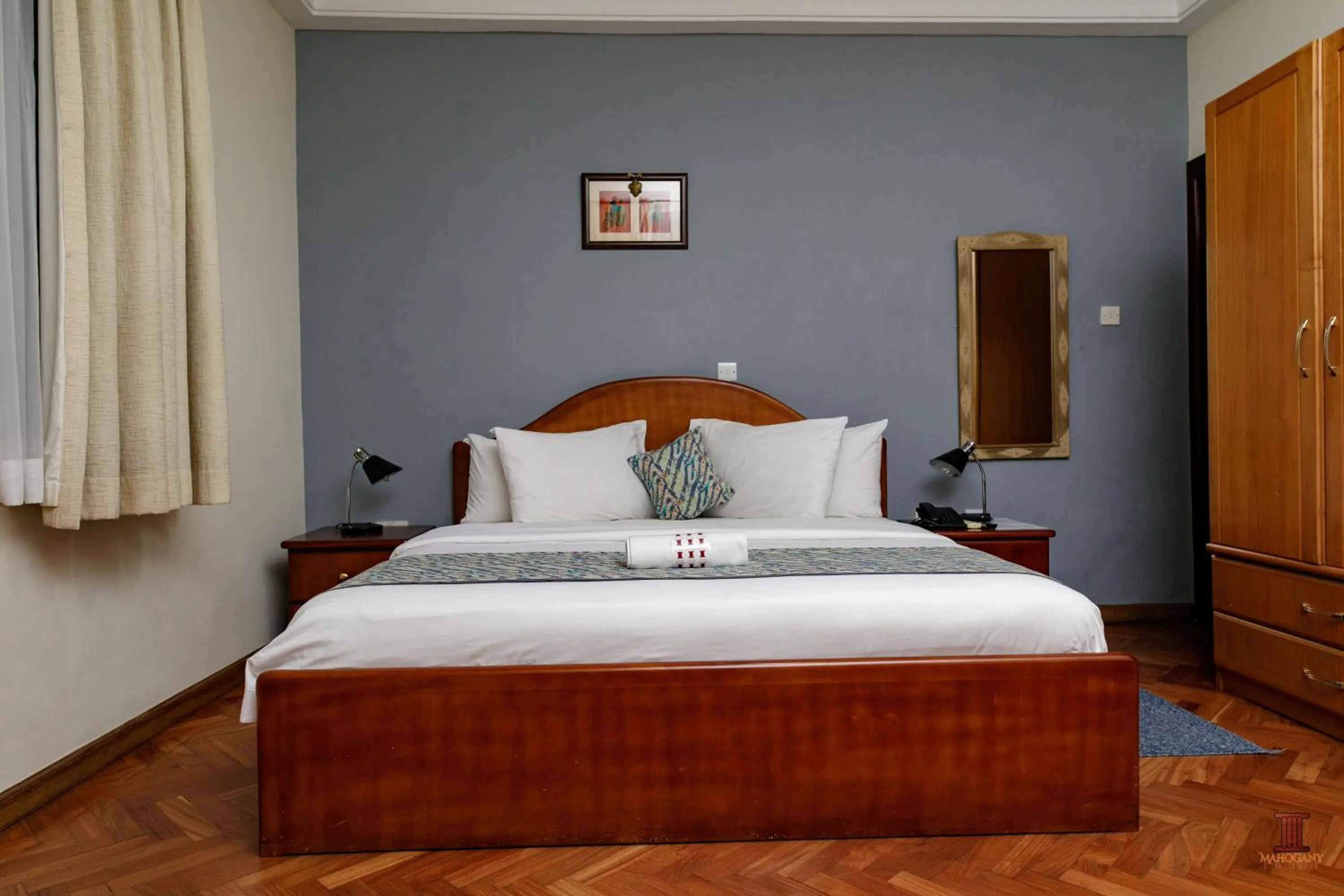 Bed in Mahogany Lodge, Cantonments