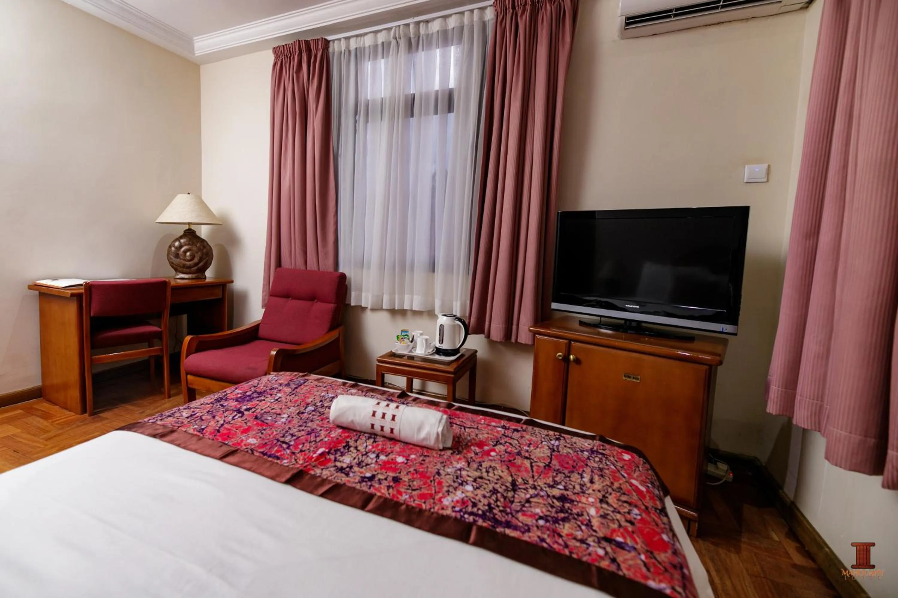 Bed in Mahogany Lodge, Cantonments