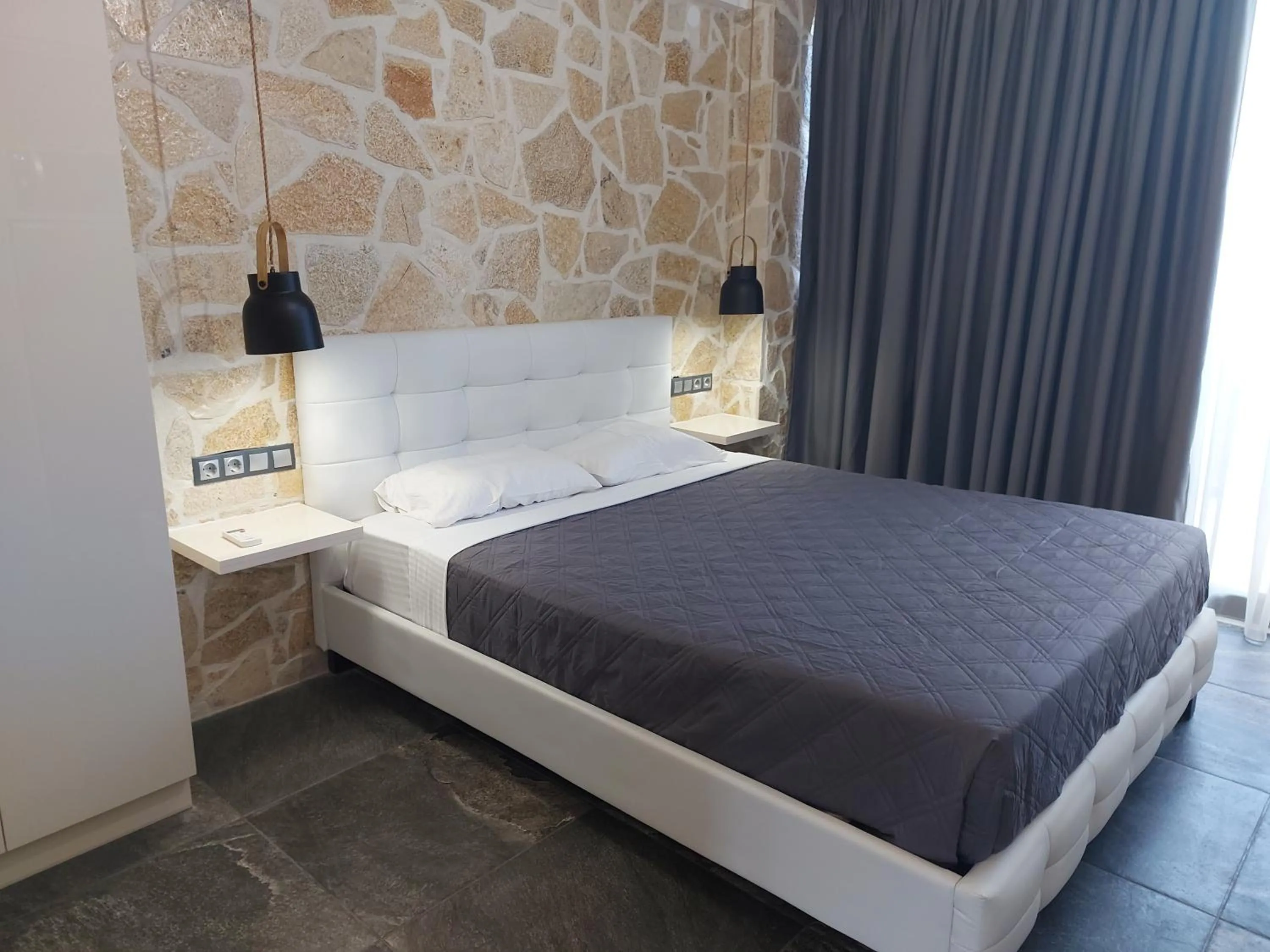 Bed in The Santo George Beach Resort