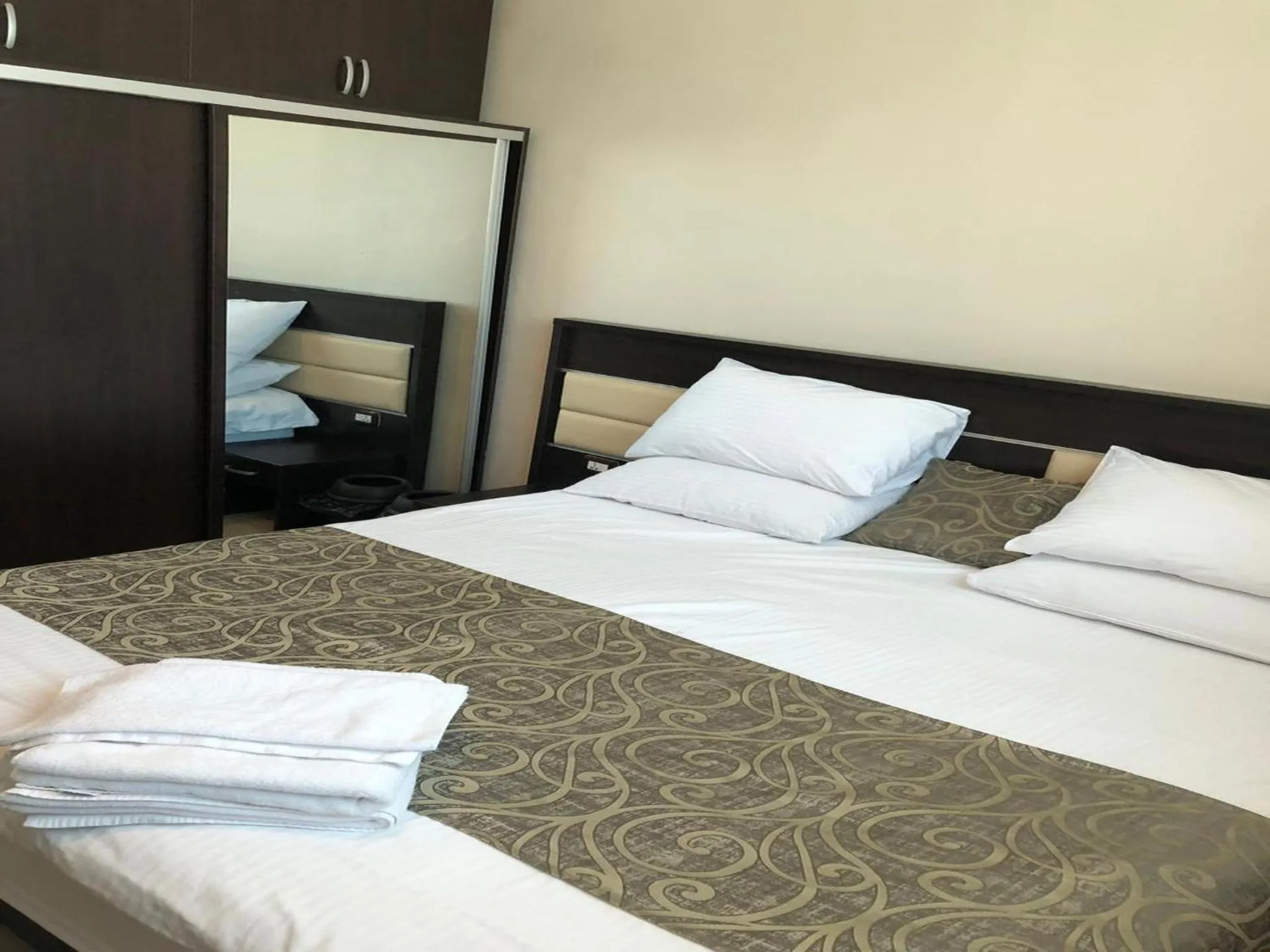 Bed in Panda Hotel Apartments