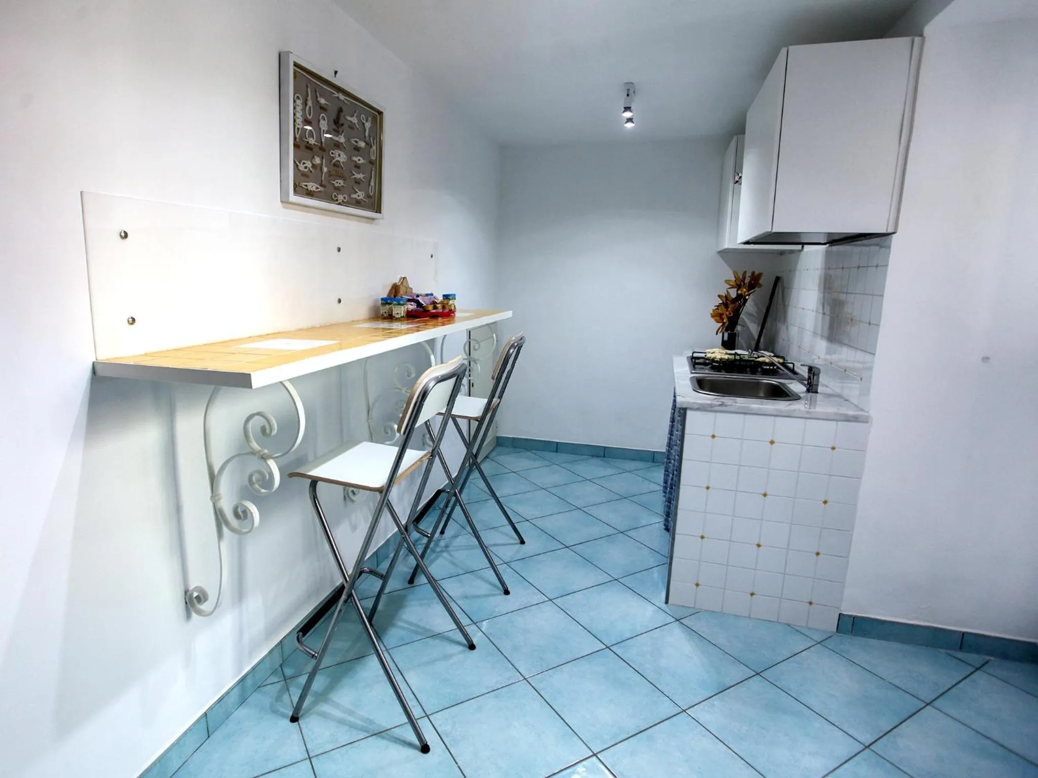 Communal kitchen in B&B La Grotta Marina