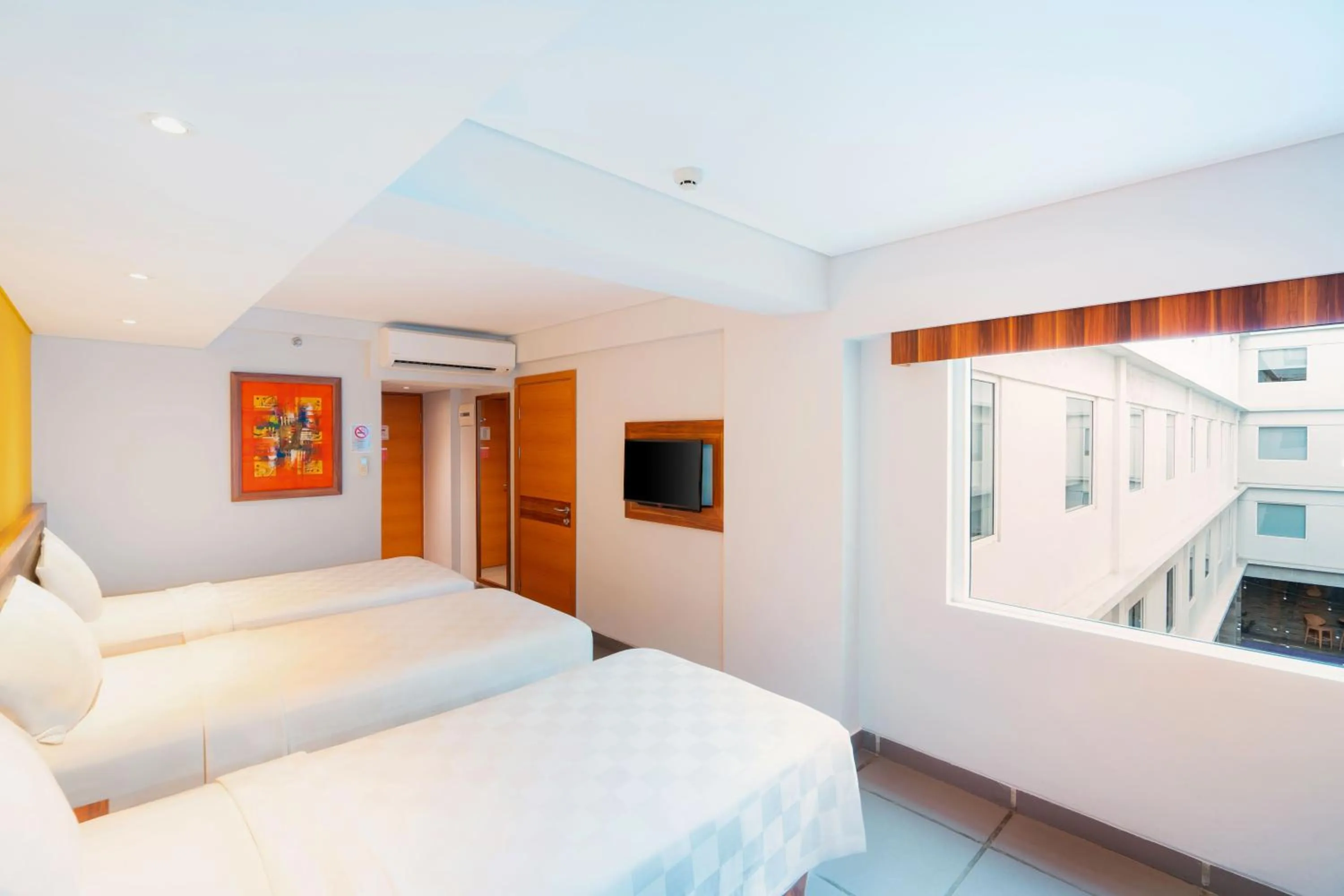 Bed in Swiss-Belexpress Kuta Legian
