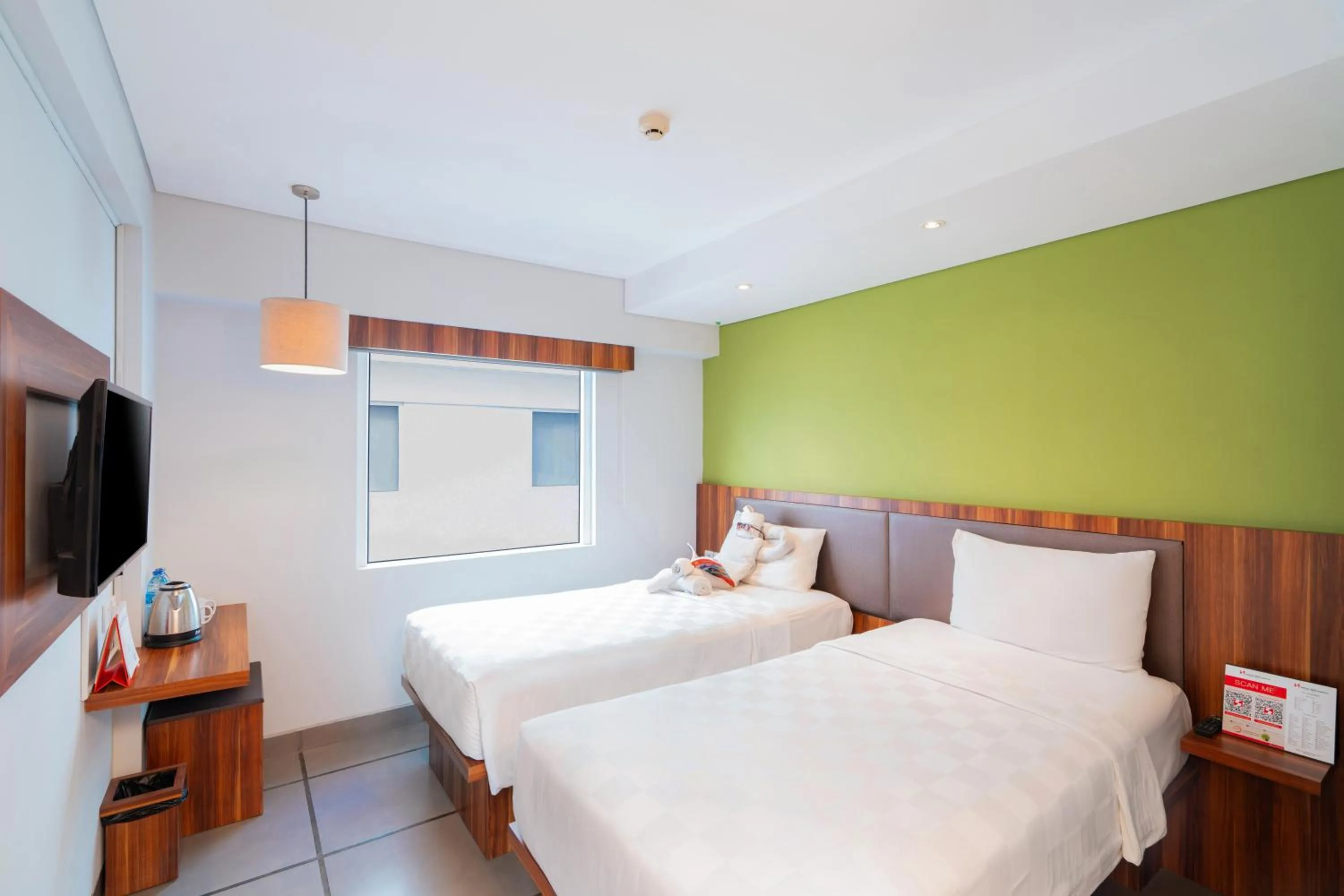 Bed in Swiss-Belexpress Kuta Legian