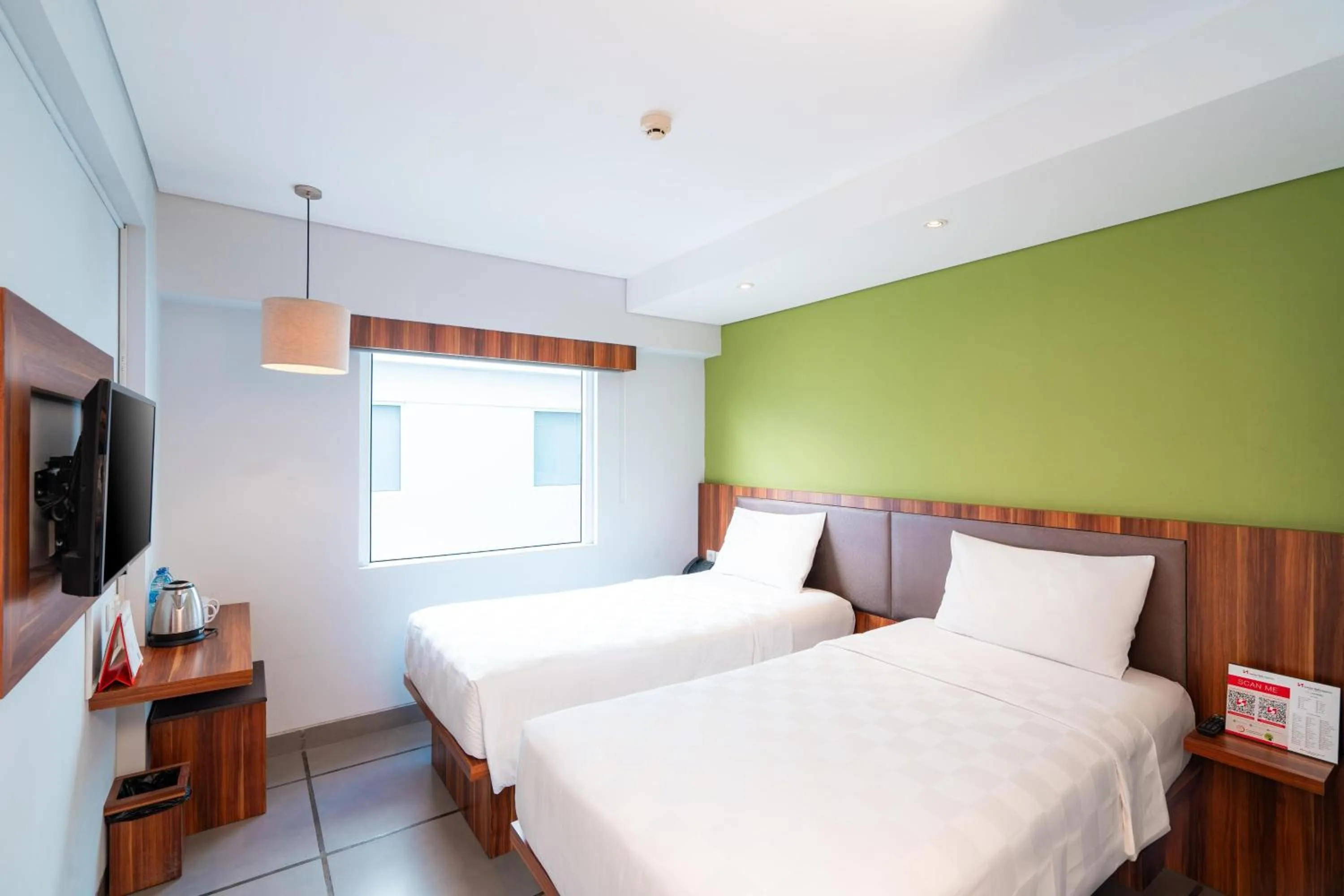 Bed in Swiss-Belexpress Kuta Legian