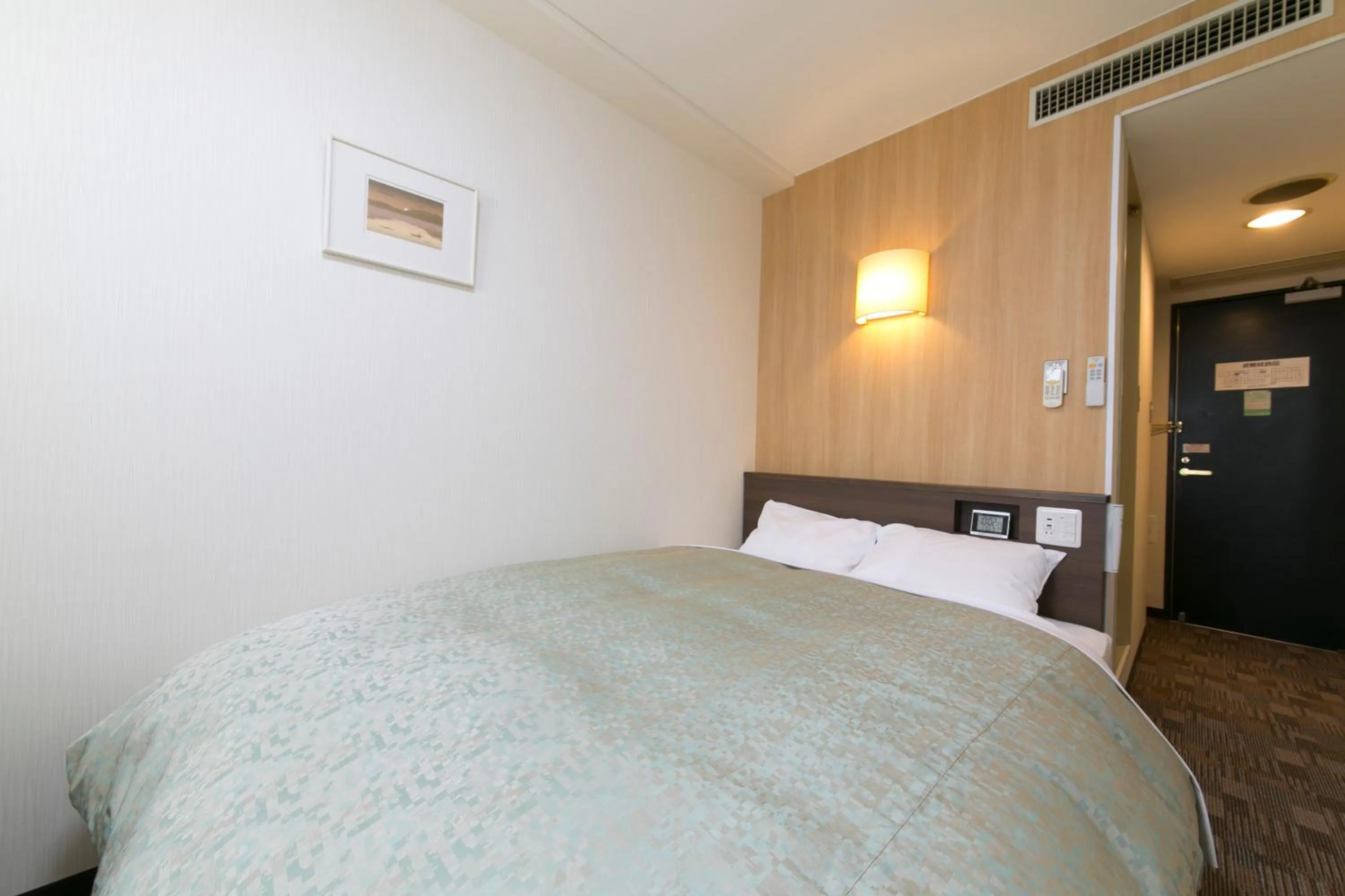 Bed in Yokaichi Royal Hotel