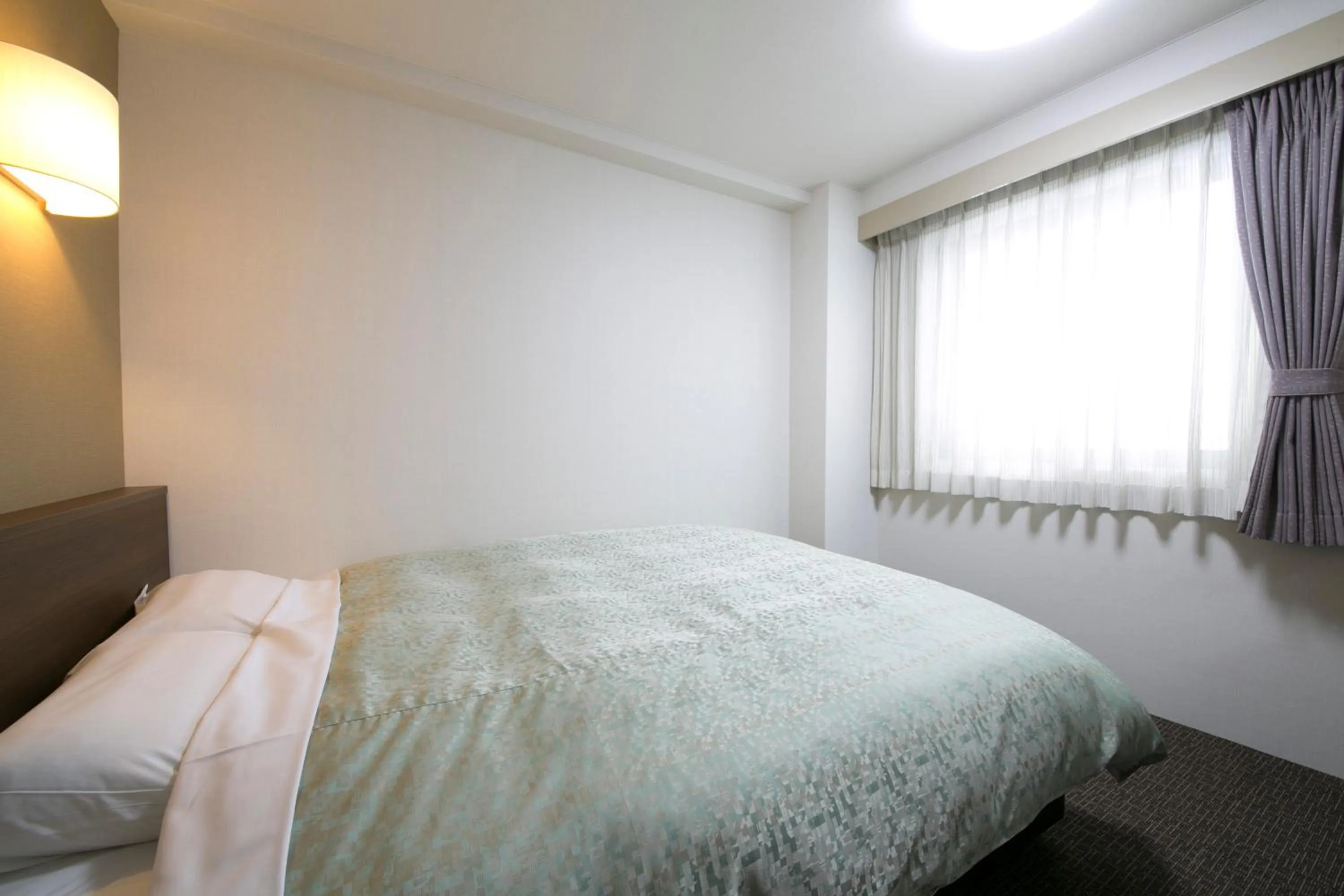 Bed in Yokaichi Royal Hotel