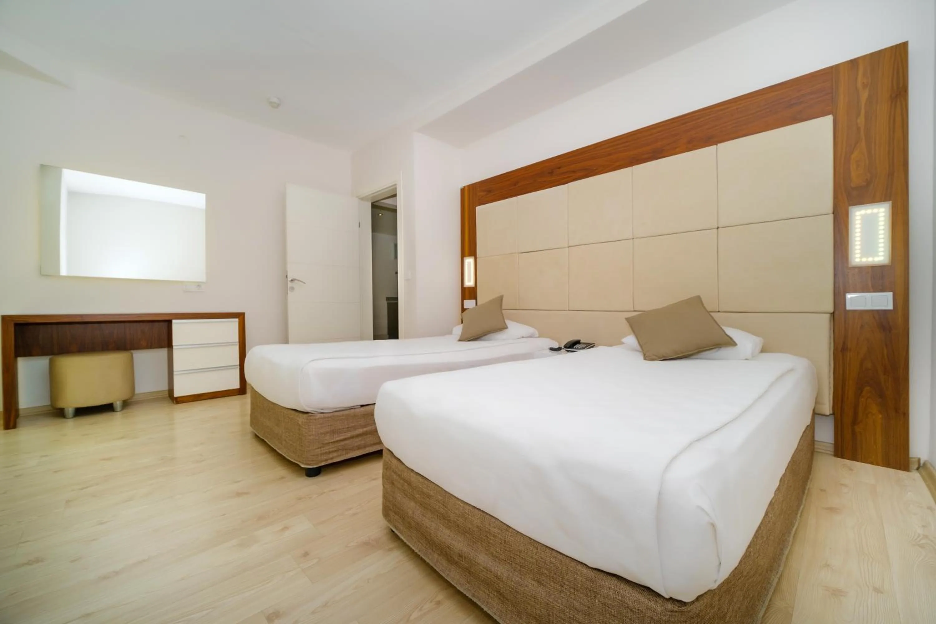 Bed in Delfino Apart Hotel